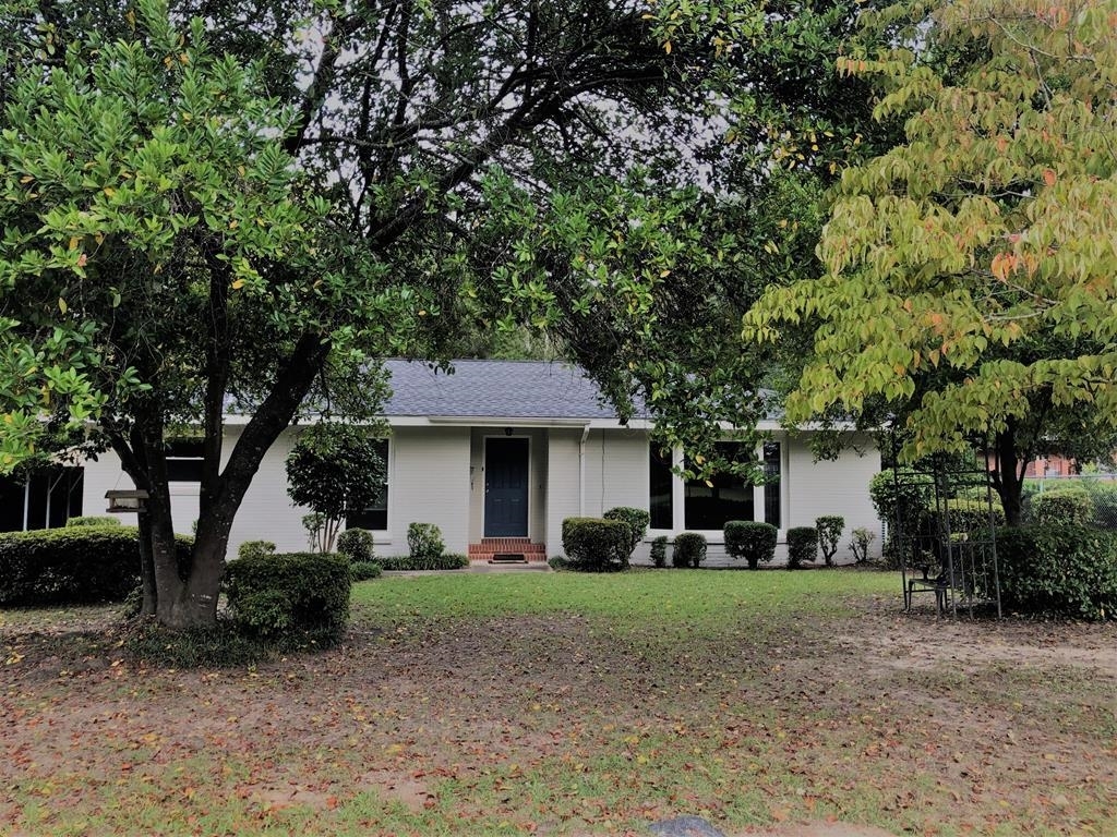 Charming home that has been recently updated. Updates include roof, wood laminate flooring, interior/exterior paint, door hardware, new windows in front, stainless appliances, kitchen countertops, and light fixtures. There is a spacious Living Room with lots of natural light. The Dining Room off the Kitchen has built in cabinet. There is a great patio area, perfect for outdoor grilling. The backyard is large and fenced with a storage building. This home is within walking distance of the college, VA hospital, shopping and dining.
