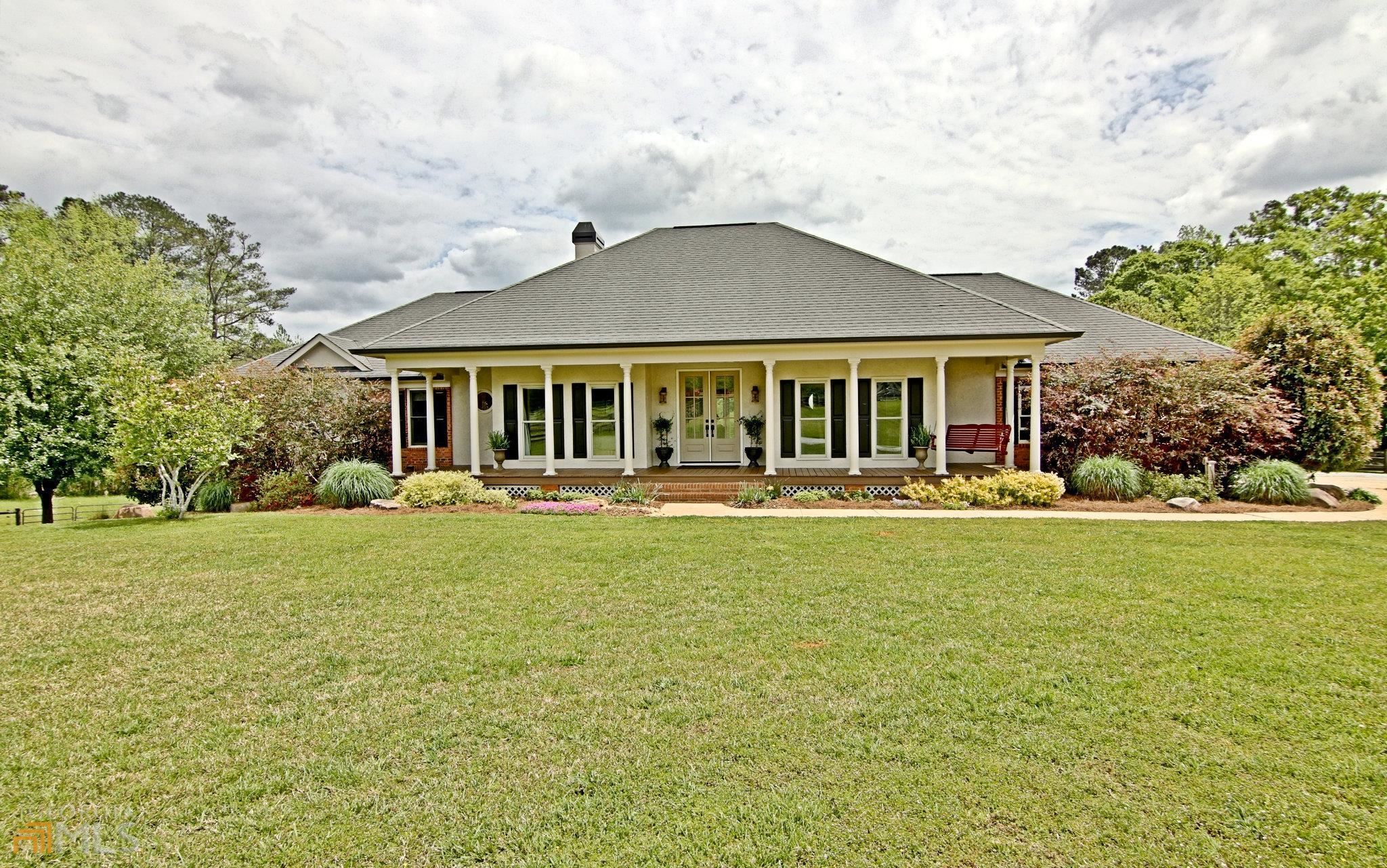 11 +/- BEAUTIFUL ACRES WITH FABULOUS BACKYARD LIVING. Perfectly secluded acres that are a combination of 2 different tax parcels PARCELS 0449 025, AND 0449 057. This is a rare find in top rated Whitewater school district. Prime location within minutes of Fayetteville, Senoia, Peachtree City, Trilith, local restaurants, and shopping. Beautifully appointed rambling brick ranch with a rocking chair front porch and an inviting sunroom with pastoral views. This home has a fully finished basement with a complete kitchen that is perfect as an in-law suite or for extended stay visitors. Enjoy expansive outdoor spaces and poolside living. One parcel has even been used as a golf driving range! Property is fully fenced for horses or livestock. The Pole barn is designed to accommodate RV/Camper/Boat parking and a Chicken coop for Fresh Eggs! In-ground pool has new liner and a copper ionization system for pristine swimming conditions. Every room is sun filled on the main level and all 5 bedrooms are spacious and inviting. Dreaming of a home with lovely views where space abounds then this is it! Enjoy the numerous photos that tell the story of this delightful property. Bring your agent or bring your buyers! Schedule an appointment today so you can Visit Us and Come Home!