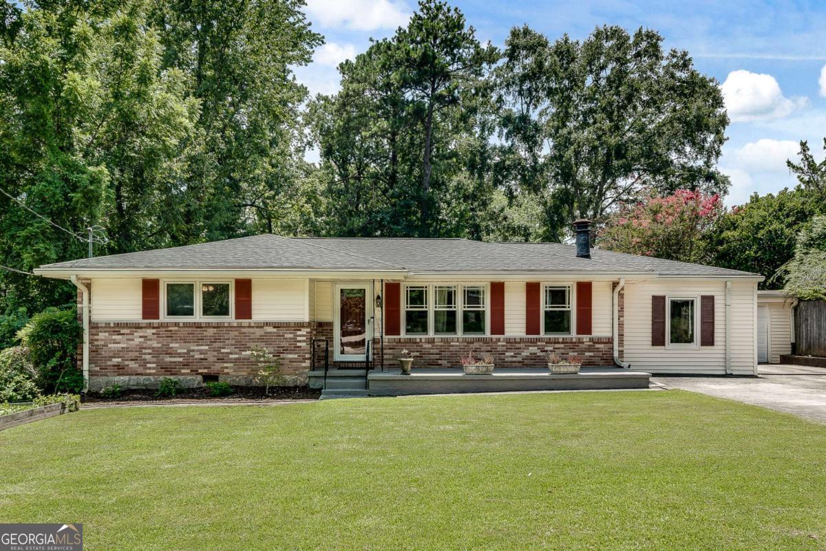 Extend your summer fun by claiming this resort-like backyard for your own! Enjoy pool parties with multiple outdoor living spaces for grilling out, lawn games, and even a little pool side cabana, perfect for foosball or air hockey. And, if you're a bit particular about your home and worried about wet partygoers traipsing through your house to find a bathroom, have no fear. There is backyard access to a half bath that you can close off from the rest of the house for guest use. This house has thought of everything - large open living spaces, expansive kitchen cabinets, two driveways, a covered carport, covered patio, spacious guest bedrooms and a large owner's suite with great backyard views. Located in a mature, well-kept neighborhood just across the street from the coming soon Lulah Hills development, you can walk to the Laurel Ridge Elementary, Publix and soon multiple new eateries and shops, as well as trails that will connect to Emory. This is the perfect location for proximity to CDC, plus you're a short drive to downtown Decatur. North Druid Woods has long been a haven for those looking to live ITP, while also favoring peace and quiet. Pool backyards like this are rare. Don't let her get away!