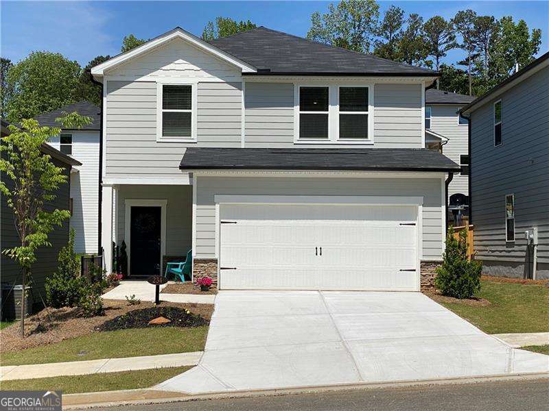 LIKE NEW in prime Holly Springs location! Sought after floorplan is light & bright, modern, open concept SmartHome with all you've come to expect: high ceilings, recessed lighting, stainless appliances, granite countertops, luxury vinyl plank flooring, tankless water heater, remote climate control, and keyless entry. Full main level suite PLUS primary suite and big loft space upstairs suitable for office/play/secondary entertainment center. Plenty of room for the whole family! And when you need to unwind, retreat to the covered back patio, or walk the quiet community neighborhood. Just off 575 and Sixes Road, Parc Terrace subdivision is near Cherokee Aquatic Center, One Life Fitness, Alpine Bakery, Publix, the outlet malls and downtown Woodstock!