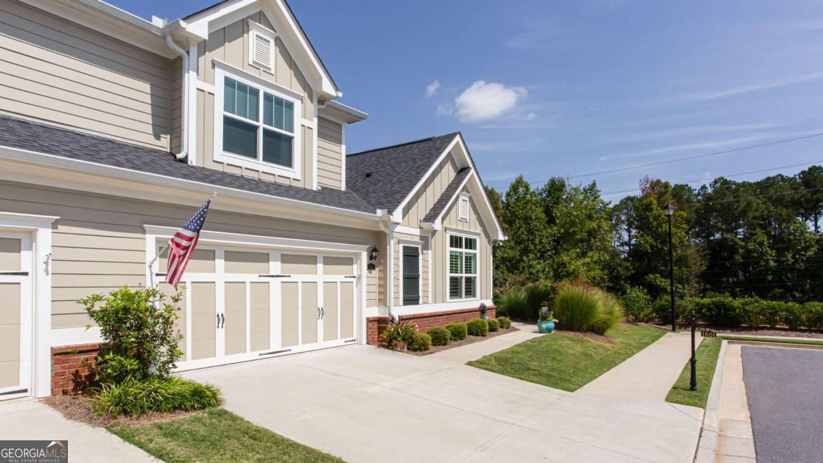Welcome to the highly sought after 55 + active adult community in Forsyth county, The Orchards of Central Park, where luxury meets low-maintenance living. This is the prime location for shopping, restaurants , wineries and convenience. This Cypress plan located at the end of the unit features 3 bedroom 3 bath with an open concept layout that seamlessly connects the living , dining and kitchen areas perfect for entertaining guests or enjoying quiet nights by the gas fireplace! The gourmet kitchen boast modern appliances, quartz countertops, ample cabinetry and a large breakfast bar. The bright and airy living space leads to the sunroom/office which also walks out to your private screened porch and patio for that morning coffee or watching the sunset. The large primary suite opens up to a large master bath and dual shelving closet with easy access to the laundry room. The upstairs has its own bedroom with a full bath along with an oversized flex room for a media room, game room or additional office . This home has upgrades galore and custom plantation shutters through out ! You don't want to miss this opportunity to live in luxury along with resort like amenities with saltwater pool, clubhouse , fitness center and elegant gathering spaces ! Come check it out!