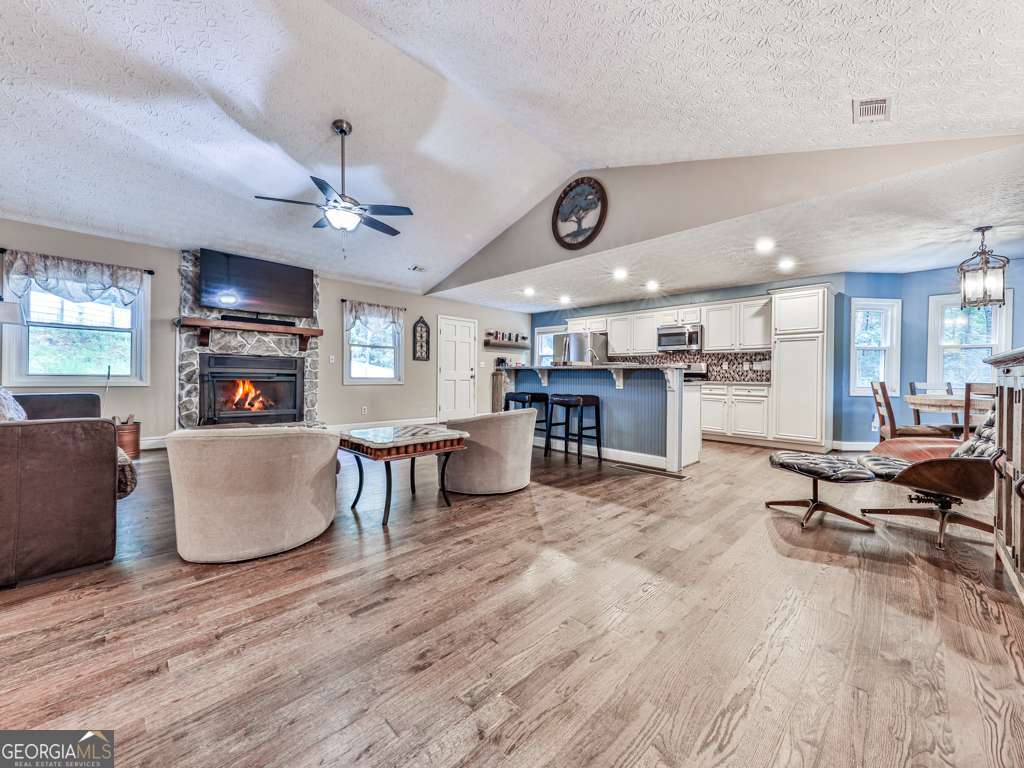 Welcome to Your Dream Home in Victoria Landing! This stunning 4-bedroom, 3-bathroom home offers 3,770 sq ft of beautifully updated living space, perfectly situated on 1.11 acres in a quiet cul-de-sac. From the moment you arrive, you'll notice the private setting of this exceptional property. Inside, you'll find two master suites, each with spacious walk-in closets and updated ensuite bathrooms-perfect for multi-generational living or hosting guests. The chef's kitchen is a showstopper, featuring granite countertops, stainless steel appliances, a breakfast bar, and a seamless flow into the living areas-ideal for entertaining. Step outside into your private backyard oasis, complete with a saltwater inground pool (installed in 2018) and an impressive 16' x 20' detached shop with a 20' x 32' covered bar/patio area-perfect for gatherings, hobbies, or outdoor living year-round. Major updates bring peace of mind New metal roof and windows (2017), HVAC Trane systems and new ductwork (2018), Recirculating Rinai tankless water heater & encapsulated crawlspace (2018) ,Spray foam attic insulation & new garage doors (2016) With no rental restrictions, this home is a smart investment opportunity or a perfect full-time residence ready for your personal touches. Enjoy HOA amenities including swim/tennis, Victoria Harbor, marina, and beaches just minutes away. You're also close to top-rated schools, downtown Woodstock, and all the shopping, dining, and entertainment the area has to offer. This home truly has it all-space, updates, amenities, and location. Don't miss your chance to own this slice of paradise!