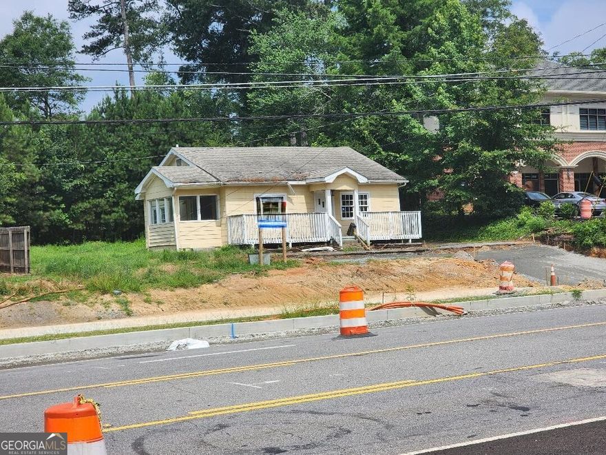 Opportunity in Alpharetta, You can teardown and build an Amazing new building near bustling downtown Alpharetta.. Tax records show it is approximately .36 of an acre. parking around back. Renovate this property, build new or combine it into an assemblage. Great for investment, owner-user, rental or redevelopment. property is located in historic downtown Alpharetta and it is currently zoned as O-I office-institutional.