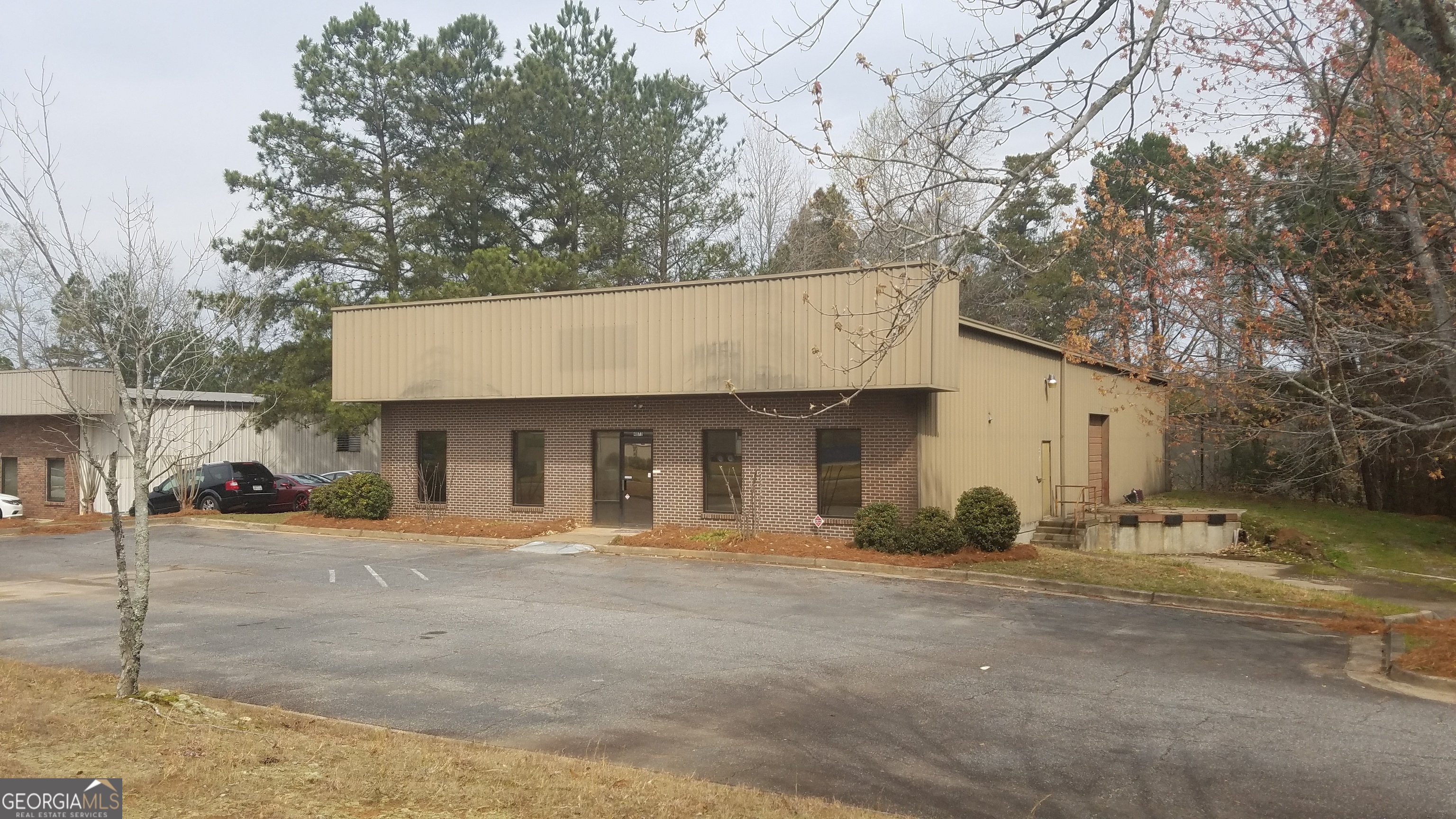 For Lease - Freestanding Flex/Warehouse Space in Prime Alpharetta Location 4073 Nine McFarland Drive | Alpharetta, GA 30004 Forsyth County | 5,000 SF | Zoned Industrial | Automotive Uses Not Permitted Presenting a rare warehouse/flex opportunity in sought-after Alpharetta. This 5,000 SF freestanding industrial building offers excellent versatility and visibility, ideal for a range of business types-landscapers, contractors, showrooms, storage, light manufacturing, and more. Located just 2.6 miles from GA 400, near Dunkin' Donuts at McFarland Parkway and Highway 9, and minutes from Halcyon, this property is positioned for both operational efficiency and regional access. With the newly widened Highway 9 just 100 yards away, logistics and employee access are seamless. Property Highlights: Size: 5,000 SF total, freestanding structure Office Buildout: Approx. 656 SF including one executive office, large bullpen space, restroom, and shop sink Loading: Multi-use door with both drive-in and dock-high access Power: 3-Phase power with 200-amp service, expandable to 800 amps Climate Control: Heated warehouse with vented roof, suitable for industrial applications Construction: Brick front with functional warehouse layout Zoning: Industrial - No automotive service uses permitted Location Advantages: Alpharetta address with the ease and tax benefits of Forsyth County Near Halcyon, Walmart, Mercedes-Benz, Francis Road area, Cumming, Roswell, and Johns Creek Excellent connectivity to major roadways and workforce Surrounded by a mix of commercial, residential, and light industrial uses This is a rare opportunity to secure a functional, well-located industrial property in a high-demand area with flexible usage potential. Ideal for businesses looking for a strong presence in North Metro Atlanta.