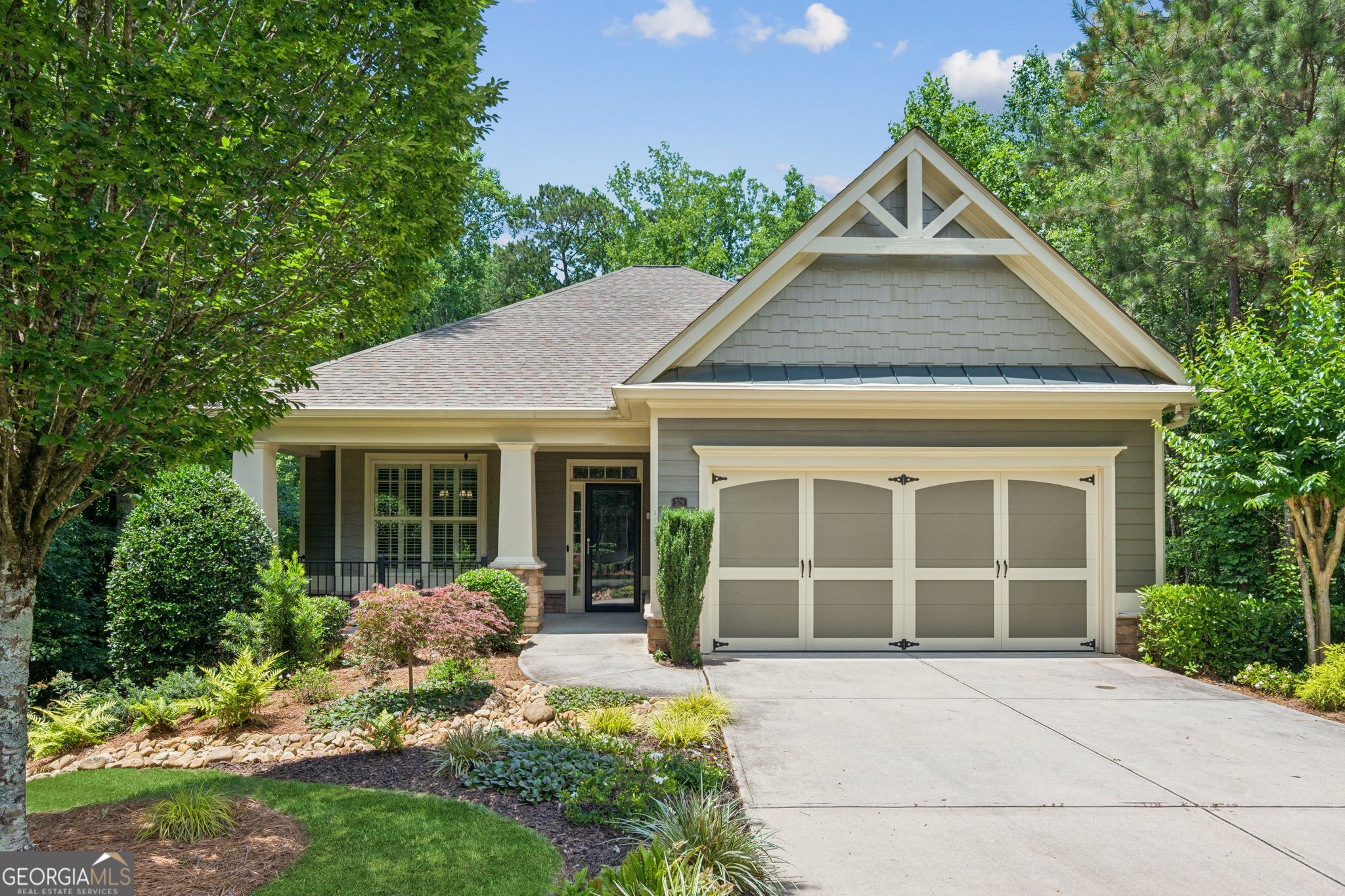 This impressive Craftsman RANCH boasts a finished terrace level and spans over 3,200 sq. ft., making it one of the largest homes in the subdivision. Nestled on a premium 1-acre lot with end-of-street privacy and just 2 homes on the alley, it offers a serene, wooded backdrop. HOA covers grounds maintenance , trash pick up, irrigation (system and water ), exterior paint, and amenities. Enjoy the open-air screened porch or lower-level deck. The savvy kitchen features granite countertops, rich cabinetry with lower pullout shelves, and flows into a spacious fireside family room. A private dining room is perfect for gatherings. The primary suite includes a dual vanity, shower, and a custom walk-in closet with vanity, hamper, jewelry storage, and personal security safe. A secondary bedroom and flex room share a full bath with an accessible shower. The beautifully finished terrace level offers a large family room with a gaming area, full bath with tub/shower, bedroom, storage, and a private covered porch with backyard access. Current owners have put more then $100,000 upgrades into the home including a whole house generator, professional landscaping, custom draperies and automatic blinds, pull outs and quiet close doors and drawers, extra shelving and storage, upgraded bath faucets and hardware, and so much more! This home offers the benefits of being in an active adult community while still enjoying your privacy. Ideally situated off Hwy. 140 near Hickory Flat, with nearby restaurants and retailers, this home is minutes from Northside Cherokee Hospital and medical professionals. Welcome to a Wonderful Active Adult Community with social gatherings and activities.