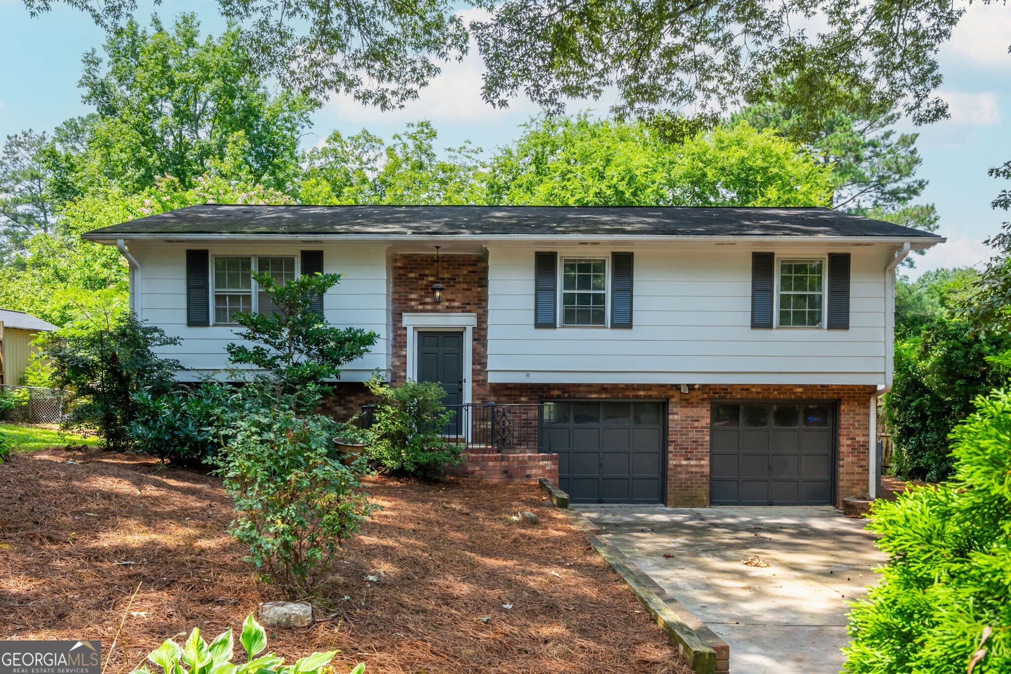 This beautiful remodeled home awaits your early morning coffee on the deck, or your entertaining of family and friends either indoors or out. Inside, throw a dinner party in the spacious living room / dining room combination with refinshed parquet hardwood floors, or post dinner s'mores outside by the firepit in your expansive backyard. New paint, new flooring, new bathrooms, new kitchen with granite and stainless appliances. You're going to love living at 1052 Rabun Drive!