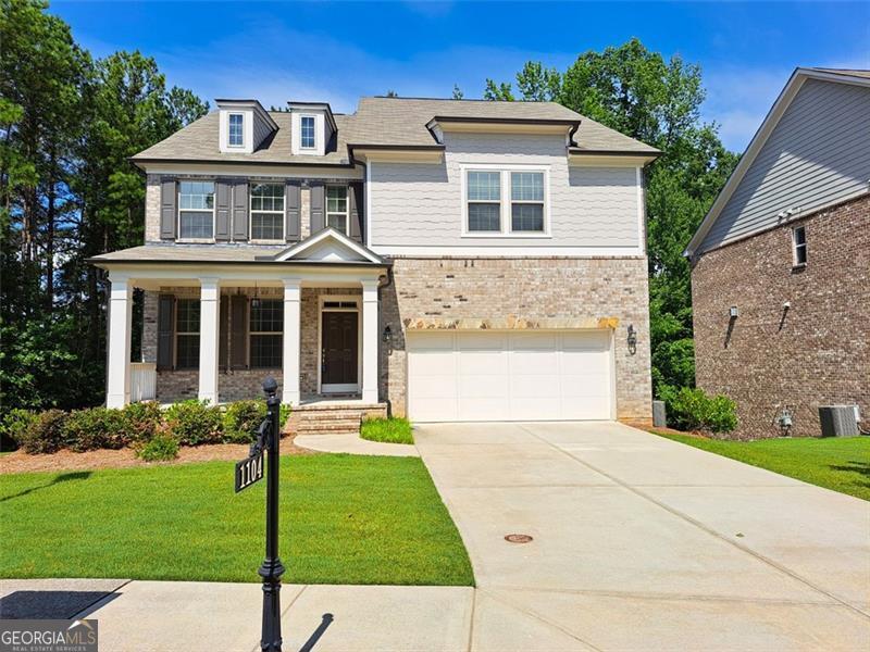 Move-in ready home in Kempston Place! Beautiful gated community located inside the emerging Technology Park, a thriving center for innovation, with easy access to work centers, recreation, dining, and shops in and around Johns Creek. This four-sided brick home on a wooded corner lot features an open concept floorplan, an unfinished basement, covered front porch with a sitting area, and a deck overlooking trees. Main level includes a welcoming foyer and separate dining room that leads into a gourmet kitchen featuring stainless steel appliances, stone counters, white cabinets, a large island, and a breakfast nook overlooking a large family room with a fireplace. The main level also has a secondary bedroom and a full bathroom. The upper level consists of two other secondary bedrooms, a shared full bathroom, a secondary suite (bedroom with full bathroom ensuite), a laundry room, and an oversized Primary Suite. The gorgeous Primary Suite boasts a luxurious ensuite bathroom with a separate tub and shower, double vanities, and a large walk-in closet. Spacious 2-car garage and lots of space for additional parking on the extended driveway. Everything you are looking for in the perfect home is all here at 1104 Hemingford Way, come see for yourself!