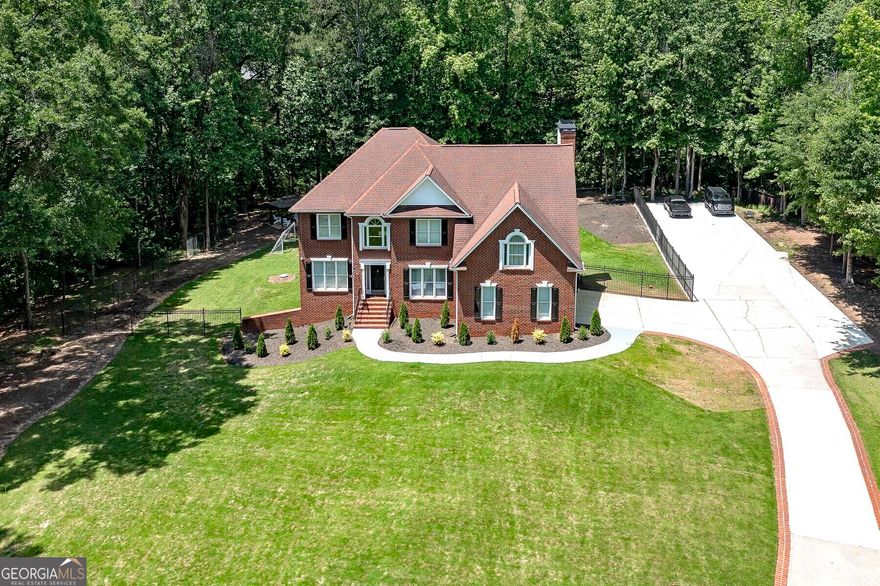 Welcome to a WONDERFUL OASIS!  This stunning Lake Dow property boasts 6 bedrooms, 4 bathrooms, and has been recently completely renovated to perfection.  The second kitchen is perfect for entertaining guests or hosting family gatherings.  Stay active and fit with the exercise room, and rest easy knowing your boat or RV will have plenty of space with the expanded parking area.  Step outside to enjoy the meticulously landscaped yard with lush zoysia sod.  Located in the top-rated Ola School district, this house is not just a home but a lifestyle upgrade.  Don't miss out on this incredible opportunity to own a piece of paradise in McDonough!
