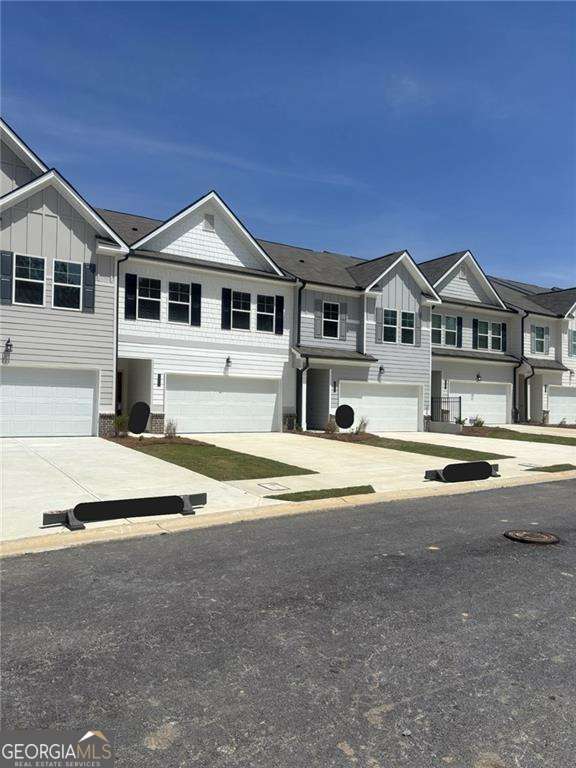 GREAT INCENTIVES Presenting the 'Edmund' floorplan, this townhome offers approximately 1,700 sq ft of upgrades and a contemporary open floorplan concept. Open Floorplan, Granite Countertops, Stainless Steel Appliances, and Elegant 42-inch Cabinets with Crown Molding. The spacious owner's suite is designed for ultimate comfort, featuring a spa-like bathroom with double vanities and an oversized walk-in closet. The townhome also includes two secondary bedrooms, an additional full bathroom, and a convenient half bathroom to meet your lifestyle needs. At Sandtown Falls, enjoy a host of amenities designed to enhance your living experience. Take a dip in the sparkling swimming pool, unwind at the cabana, or let your children explore and play at the playground. Your furry friend will love the cozy doggy park. This community has it all! Convenience is Key: Sandtown Falls is close to fine dining, shopping, and entertainment options. Local supermarkets and fitness gyms are just minutes away. With its strategic location, you'll have easy access to major highways such as I-20, I-85, and I-285. Plus, Atlanta Hartsfield-Jackson International Airport is just a short 15-minute drive away. Discover your new home at Sandtown Falls and indulge in the perfect blend of luxury and convenience. Interior photos are Stock Photos Our Showing hours are Sunday 1:00 pm - 6:00 pm, Monday 12:00 pm - 6:00 pm, Tuesday -Saturday 10:00 am - 6:00 pm