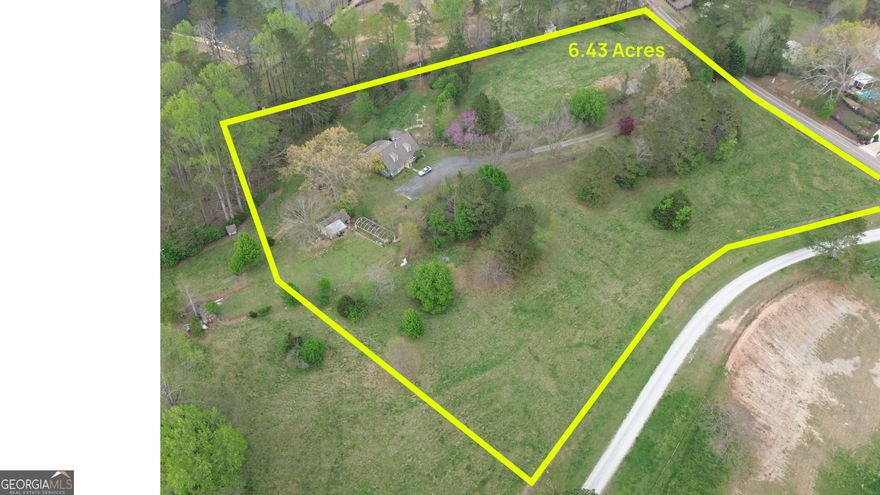 Discover an incredible opportunity to own 6.43 acres of prime land in the highly sought-after city of Alpharetta, right off Liberty Grove Road-all with the added benefit of lower Cherokee County taxes. Situated in the heart of Alpharetta's horse country, this expansive property offers endless possibilities for custom home builders or buyers looking to create their dream estate in a serene, private setting. This property boasts dual road frontage on Liberty Grove Road and Rivendell Lane, providing the potential for multiple access points and enhanced flexibility for development. The elevated hilltop setting offers stunning views, making it an ideal backdrop for a luxury home. An existing home sits on the property, but the true value lies in the land-offering a blank canvas for a custom estate or future development. The property includes a small cemetery (0.16 acres), with easement rights retained by the previous owners for future access and maintenance. Enjoy the perfect blend of privacy and convenience, with easy access to top-rated schools, shopping, dining, and major highways. Whether you're envisioning a private estate, family compound, or signature build, this property offers the space and potential to bring your vision to life.