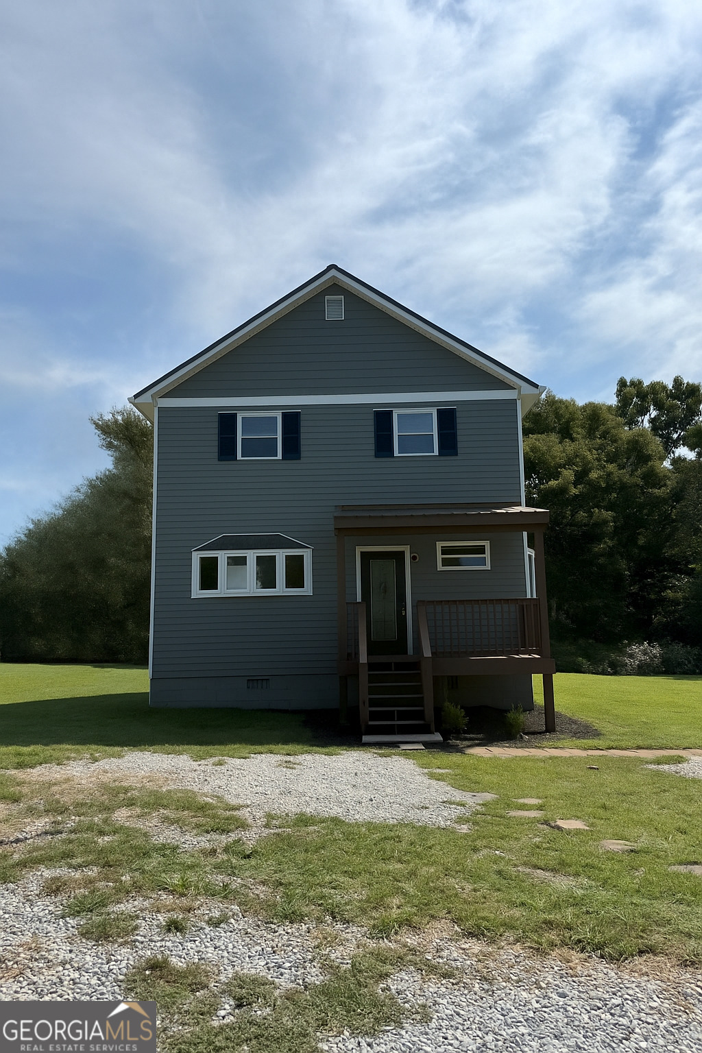 Tucked away on a spacious 2-acre lot, this beautifully updated 2-story Craftsman-style home offers the perfect blend of privacy, comfort, and convenience. A long driveway welcomes you to the property, providing a peaceful, secluded feel while still being just minutes from downtown Winder and all its shops, restaurants, and amenities. The home features 2 bedrooms and 2 full bathrooms. Inside, you'll find brand new luxury vinyl plank flooring throughout, a brand-new HVAC system for year-round comfort, and a thoughtfully designed kitchen complete with granite countertops and stainless-steel appliances. The laundry is conveniently located on the first floor, making daily chores a breeze. Outside, the fenced backyard is perfect for pets, kids, or entertaining guests, with plenty of room to garden, play, or relax. A 2-car carport adds extra convenience and protection for your vehicles. Don't miss the chance to own this charming and private piece of Winder living!