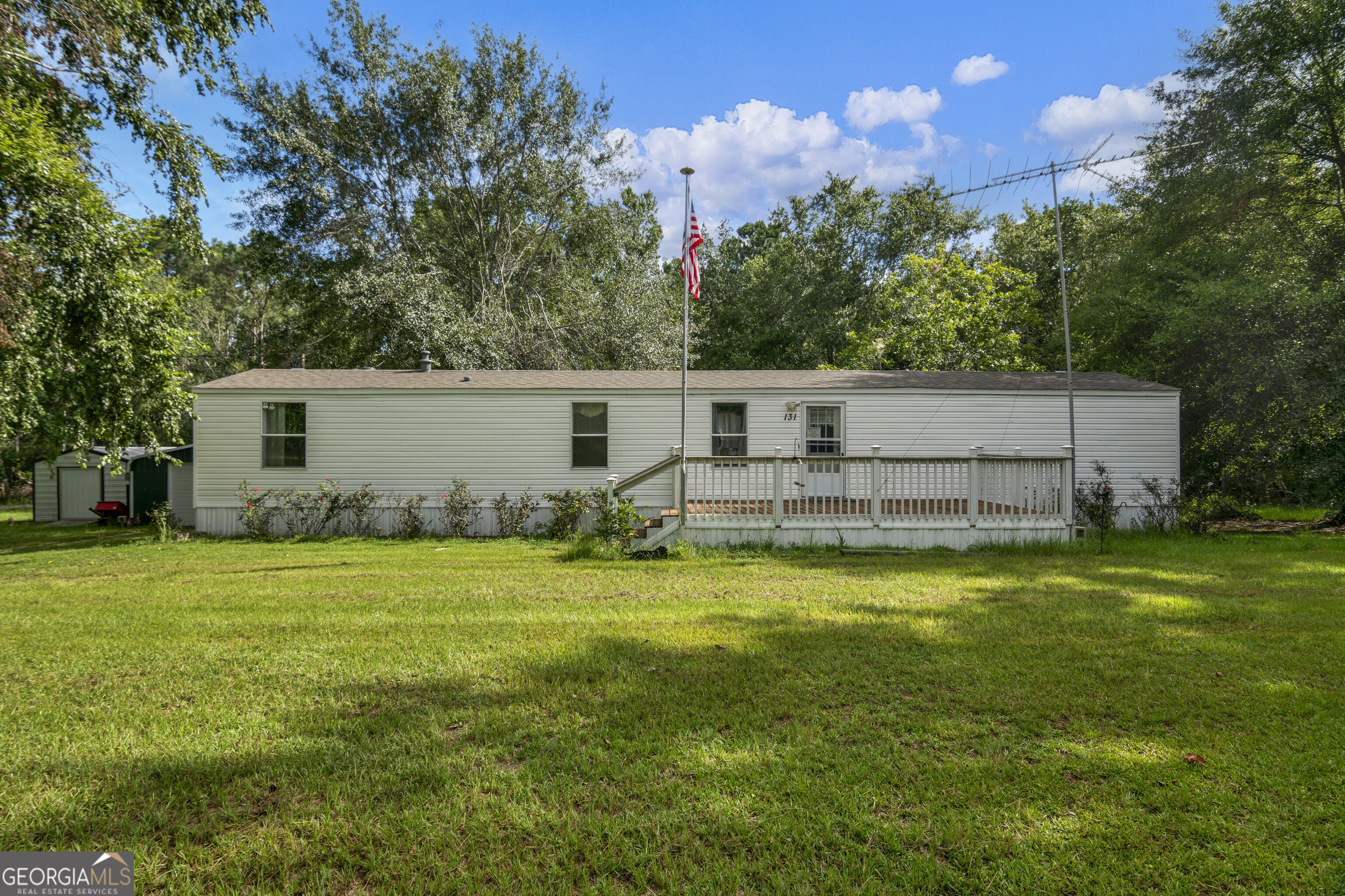 Set on a quiet and private 3-acre lot, this well-maintained home offers a peaceful retreat with 3 bedrooms and 1 bathroom. The open floor plan features durable LVP flooring throughout and a comfortable, functional layout. Enjoy the outdoors from the front or back porch, perfect for relaxing and taking in the natural surroundings. The property also includes a detached garage/workshop and a utility shed, providing plenty of space for storage or hobbies. A great combination of privacy, charm, and practicality.