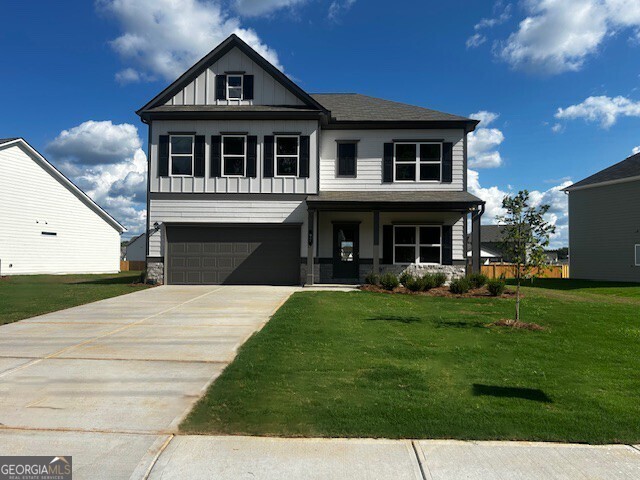 Move in Ready! The James plan in the Jackson Farm community, built by Smith Douglas Homes. Jackson Farm is a swim community! Flexibility is the hallmark of The James plan. The home features a large separate dining room, fireside family room, bedroom and full bath, well appointed kitchen with granite, upgraded cabinets, tile backsplash, a generous pantry area, and a large island. There is a butler's pantry between the dining room and kitchen for easy entertaining. The large mudroom off the garage gives you the space you need to drop your belongings by the door on your way in or out! Amenities on the second floor include a spacious and convenient laundry room with a sink, an open loft and an Owner's suite with a sitting room, owner bath has separate tiled tub and shower, two guest bedrooms and two full baths. All this on a level homesite with a covered patio. Both stories have nine ft ceiling heights! Photos are representative of plan not of actual home being built. Seller incentives with use of preferred lender.