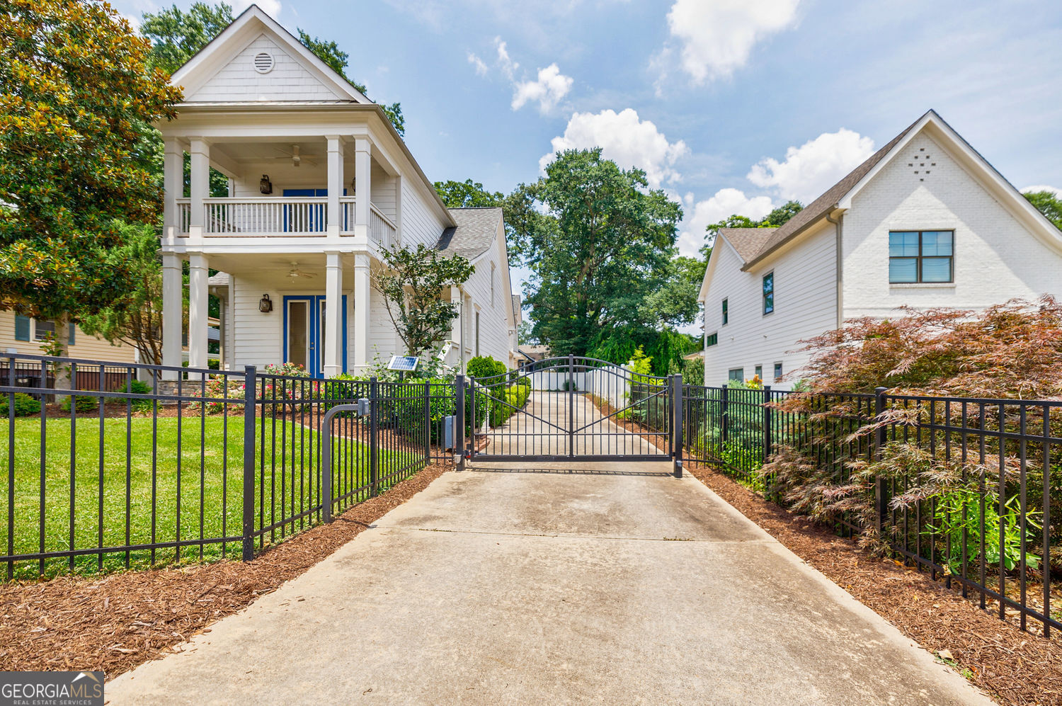 This Custom-built Gated Craftsman style home is located across the street from top-rated Woodward Academy, and a short drive from Downtown Atlanta, Hartsfield Airport, Porche and Tyler Perry Studios. Featuring 4 bedrooms and 4 full baths. One bedroom and a full bath is conveniently located on the Main Level. Open living/dining floorplan. Livingroom has built-in cabinetry and double doors to front porch. Kitchen with granite counter tops, stainless steel appliances, and walk-in Pantry. The Primary bedroom suite has barn door to new updated bath with large glass shower and double doors to balcony. A second bedroom, a full bath and an office/loft space with built-in desk completes the upper level. The Main level also features a walk-out kitchen breezeway with side door to the two-car garage. A large bedroom/ flex room with full bath is above the garage and is perfect as a guest/ teenage suite or Airbnb/ rental space. Additional features are new carpet in bedrooms, new neutral paint throughout, custom closets, 3 HVAC systems, irrigation, private fenced-in backyard and automatic gate. Don't miss your chance to call this charming house your Home!