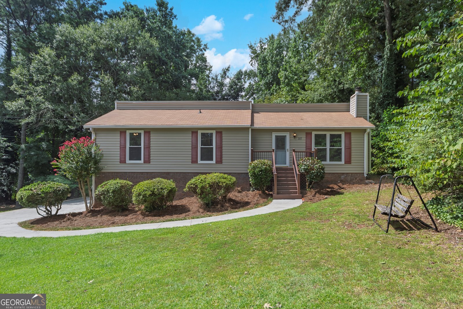 You must come see this adorable ranch home on a cul-de-sac street. Your new home is in an ideal location, just minutes from downtown Woodstock! Woodstock has so much to offer with free concerts in the park, farmers markets, miles of walking trails, a dog park, fantastic entertainment venues, wonderful shops, and restaurants. The home is in a quiet neighborhood away from the hustle and bustle, with a large level open lot. There are four spacious bedrooms and 2 full bathrooms. The beautiful kitchen with SS appliances, granite countertops, and 42" cabinets. Hardwood flooring in the family room. New carpets and fresh paint in the bedrooms. The bathrooms have just been updated. Large closets and lots of storage! Enjoy the heated and cooled sunroom year-round with peaceful views of your private backyard. The windows are energy efficient to keep those utility bills low. Upgraded vinyl siding on the exterior for easy maintenance. The charming front porch is Trex decking. The unfinished basement is awaiting your finishing touches. The driveway is long and level for when guests arrive. Over half an acre for plenty of room for entertaining or gardening. No HOA! Make an appointment to see this home today!