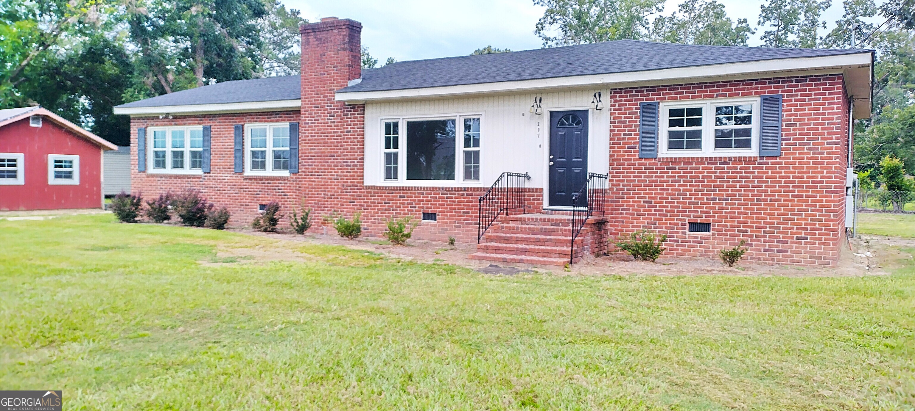 3BR/2BA Brick Ranch in the heart of Brooklet - 0.35 acres in a quiet neighborhood close to schools, dining, and shopping. Recent updates to this spacious home include a remodeled kitchen with Energy Star appliances, new Energy Star windows, fresh interior paint, new lighting and laminate flooring all under a roof less than 2 years old. The large rear deck is ready for relaxing or entertaining. Cosy wood-burning fireplace adds charm. The bonus room can be a perfect office, hobby/game room, or 4th bedroom. Vintage baths offer upgrade potential. Includes 16x24 powered outbuilding (as-is).