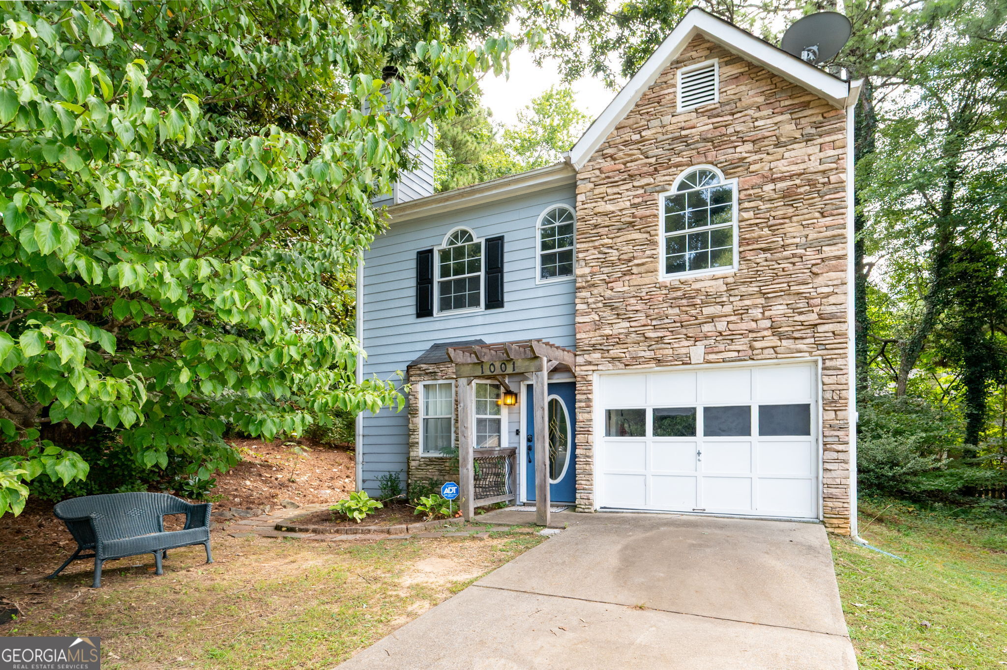 Welcome to your beautifully updated home where modern elegance meets everyday comfort. Tucked within the desirable side streets of Kennesaw, this 2-bedroom, 2-bathroom home with 1,472 square feet has been thoughtfully renovated to offer style, function, and timeless appeal. Step inside to an inviting open layout highlighted by rich flooring, abundant natural light, and a cozy fireplace that sets the tone for relaxing evenings at home. The designer-inspired kitchen is a true centerpiece, boasting sleek gray cabinetry, quartz countertops with waterfall edge detail, a stylish herringbone backsplash, and premium stainless steel appliances. Perfectly designed for both daily living and entertaining, the kitchen flows seamlessly into the dining and living areas. The primary suite is a serene retreat featuring a spa-like en suite bathroom with dual vessel sinks, backlit mirrors, a modern floating vanity, and an oversized frameless glass shower with upgraded fixtures. A walk-in closet completes the space, combining luxury with convenience for your private escape. The secondary bedroom is equally inviting with its large arched window and easy access to the second fully renovated bathroom with quartz counters and contemporary finishes, and stunning tiled floors. . Additional highlights include fresh neutral paint throughout, modern light fixtures, updated fans, and a bonus flex space on the main accented with a charming stone wall and a bonus open flex space on the second floor. Both are perfect for a home office, creative retreat, or many other possibilities. Your private backyard offers just enough room to enjoy the outdoors without being overwhelmed with maintenance. A raise, gated patio offers the ideal setting for dining al fresco, or creating a secured space for pets or children in this peaceful escape surrounded by mature trees. Beyond the property, the location is unmatched. Residents of Kennesaw enjoy proximity to vibrant shopping and dining at Town Center, outdoor recreation at Kennesaw Mountain National Battlefield Park, and quick access to major highways for an easy commute into Atlanta. Top-rated schools, nearby universities, and a strong sense of community add to the appeal, making this home a perfect blend of lifestyle and convenience. Unmatched comfort, luxury living, and location location location. Your new home is waiting for you!