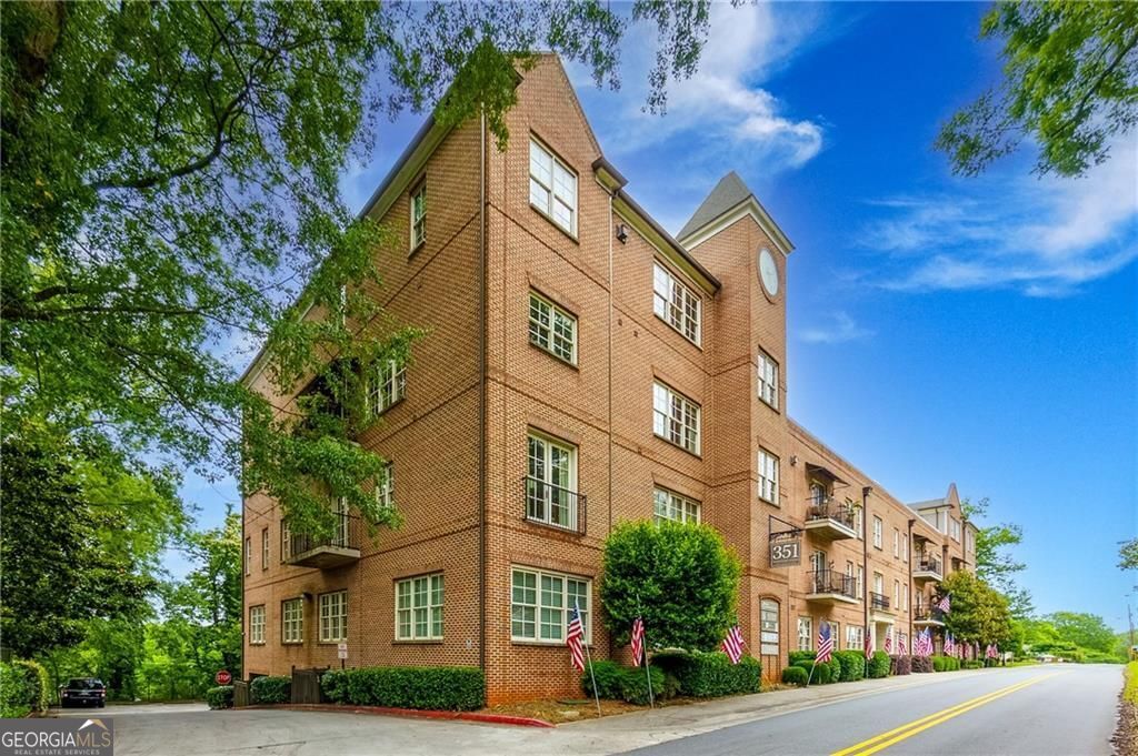 Prepare to be enchanted by this extraordinary property, a true gem that effortlessly combines elegance with functionality. This 4 sided brick condominium exudes such charm with a warm inviting entrance. As you step inside, you are welcomed into a grand foyer that sets the tone for the entire residence. As the original model home, this condo has many carefully chosen finishes. The French doors off the family room open up to a balcony where you can enjoy your morning cup of coffee. You will also enjoy a front row seat when the yearly firework festivities from the Marietta Square begin! Adjacent to the living room is the gourmet kitchen, a culinary haven that is designed for those who adore cooking and entertaining. Featuring state-of-the-art Bosch appliances, exquisite cabinetry, and ample counter space. Be sure to check out the roof top deck and community gathering room for your next event. Don't miss the chance to make this exquisite residence your own.