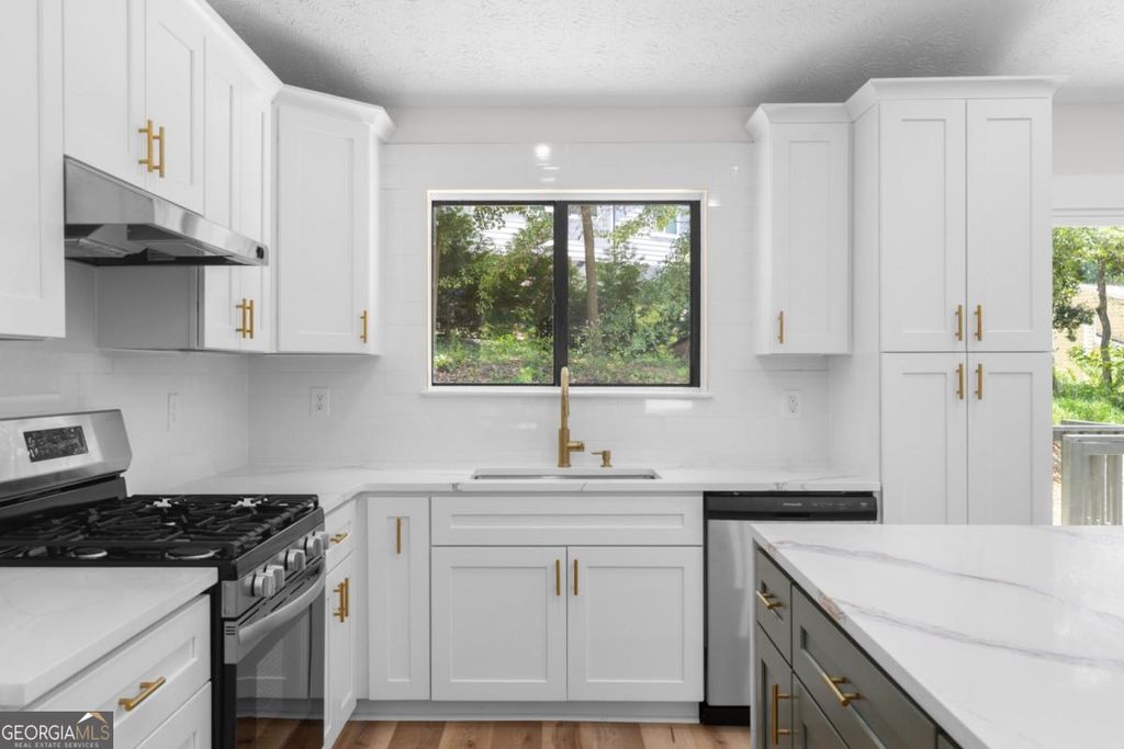 Photo of 847 Half Moon Hollow, Lilburn, GA 30047 (MLS # 10803409)