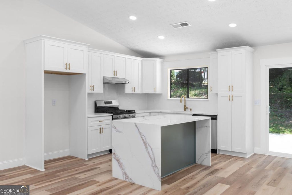 Photo of 847 Half Moon Hollow, Lilburn, GA 30047 (MLS # 10803409)