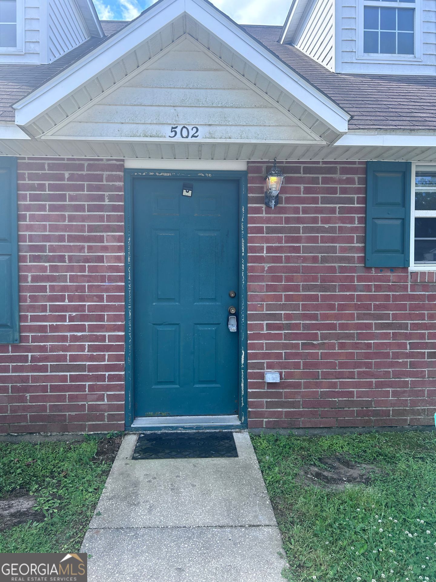Brick townhouse, Three bedroom, two bath in Sugarmill Plantation. Includes lawn care and community amenities.