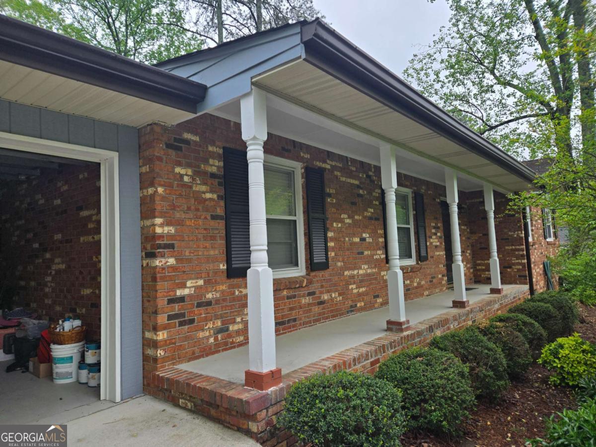 Discover the epitome of easy living in the heart of East Cobb! This well-maintained brick ranch offers a rare stepless layout, ideal for accessible and comfortable living. Featuring 4 bedrooms and 2 full bathrooms, the home blends classic charm with practical design. Step into a formal living room that flows into a cozy family area, connected seamlessly to the kitchen-creating a warm, central space for daily life and entertaining. The spacious dining room is perfect for hosting gatherings, while the private backyard provides a peaceful retreat for outdoor enjoyment. The primary suite offers an en suite bath and a calm escape, while three additional bedrooms provide flexibility for guests, family, or a home office.