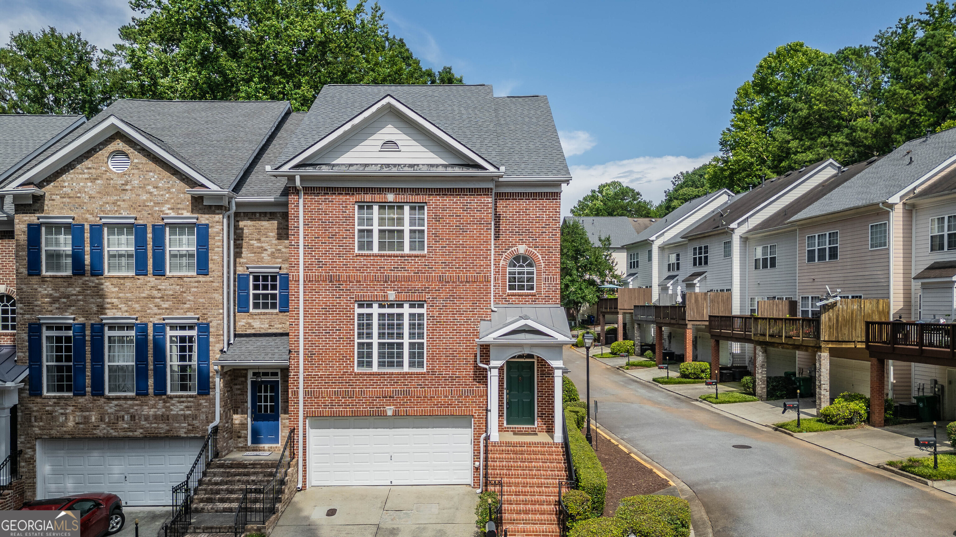 Spacious 4-Sided Brick Townhome in Gated Chamblee Community Welcome to the largest floor plan in this private, gated neighborhood-an elegant four-sided brick townhome offering abundant space, comfort, and style. Step inside to find brand-new flooring on the main and basement levels, plus fresh paint throughout, giving the home a crisp, updated feel. The main level showcases high ceilings and an open living-dining area centered around a charming upgraded mantle with gas logs, perfect for cozy evenings. The chef's kitchen features rich cherry cabinetry and sleek stainless steel appliances. Upstairs, the spacious primary suite is matched by a second bedroom of equal size-ideal for guests, family, or flexible use. Both bedrooms have walk-in closets, and spacious bathrooms with full size tubs for a relaxing soak and standing showers. Downstairs, the finished basement includes a large bedroom and a generously sized bonus room that was previously used as a dedicated meditation space-a rare and valuable feature for those seeking a peaceful retreat for mindfulness, yoga, or focused creative work. Whether you continue using it as a sanctuary or transform it into a home office or studio, this quiet, versatile room adds unique value and intention to the home. The garage opens onto a driveway that can hold two additional cars. Located in vibrant Chamblee, this home places you close to Mercer University, the CDC, and the diverse dining and culture of Buford Highway. Enjoy the perfect blend of size, style, and location in one of Atlanta's most up-and-coming areas.