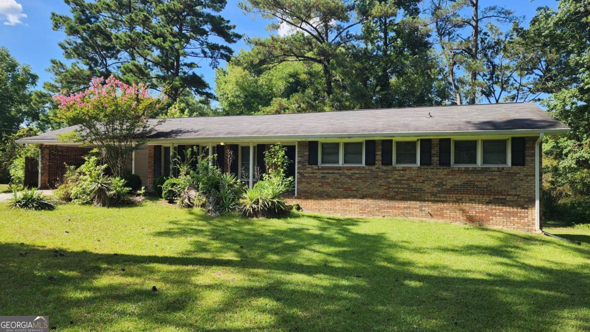 Make a great deal even better with Massive savings through special loan programs with the Preferred Lender Envoy Mortgage with Aubrey Wilcox! Ask the Listing Team for the introduction for up to 100% Financing or even interest rates in the 4s! Tucked away on a quiet street, this 3-bedroom, 2-bath home in Conyers offers a spacious layout and a great opportunity for buyers ready to roll up their sleeves. The home features a large living room, separate dining area, and a functional kitchen layout ready for updates. The primary bedroom includes an en-suite bath, and the secondary bedrooms offer generous space and natural light. Sitting on a wooded lot with a private backyard, the property has excellent potential with a little TLC and cosmetic improvements. Located just minutes from Olde Town Conyers, shopping, dining, and convenient access to I-20, this is a chance to own in a well-established area with room to add value.