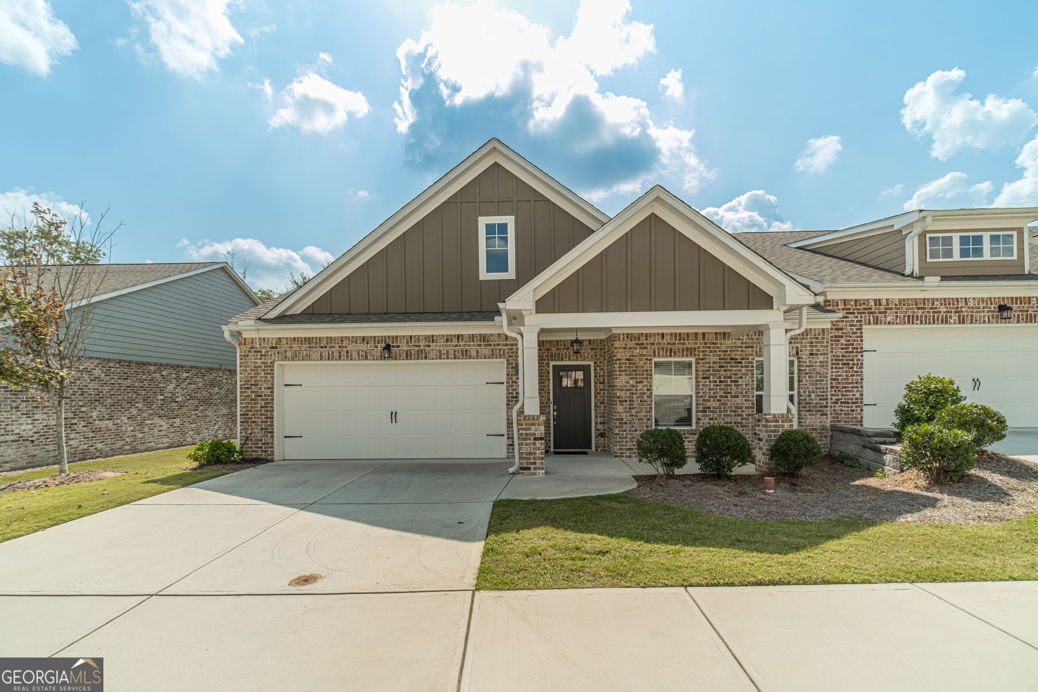 Welcome to 1584 Long Shadow Lane, a beautifully maintained end-unit ranch in the quiet, low-maintenance 55+ community of Gladstone Landing in Snellville. Built in 2021, this home blends modern comfort with easy, single-level living. Step through the front door and you're greeted by an open, light-filled layout where a spacious fireside living room flows effortlessly into the dining area and chef-ready kitchen. Crisp cabinetry, granite countertops, stainless steel appliances, large walk-in pantry and a generous island create the perfect setting for everyday meals or casual entertaining. The primary suite is a private retreat with a spa-inspired bath featuring dual vanities, a large walk-in shower, and an oversized closet. A well-appointed second bedroom and full bath offer plenty of space for guests or a home office. Thoughtful touches-wide doorways, stylish fixtures, and abundant natural light make every corner feel inviting. Relax outdoors on the screened-in porch overlooking a fenced backyard, ideal for morning coffee or evening gatherings. A two-car garage and HOA-maintained landscaping mean you can spend more time enjoying life and less time on upkeep. This location offers the best of both convenience and tranquility: you're just minutes from downtown Snellville's restaurants and weekly farmers market, with easy access to Highway 78 for a quick drive to Stone Mountain Park or the shops and dining of Loganville and Lawrenceville. Whether you're downsizing or simply ready for a low-maintenance lifestyle, 1584 Long Shadow Lane delivers comfort, style, and a setting you'll love coming home to.