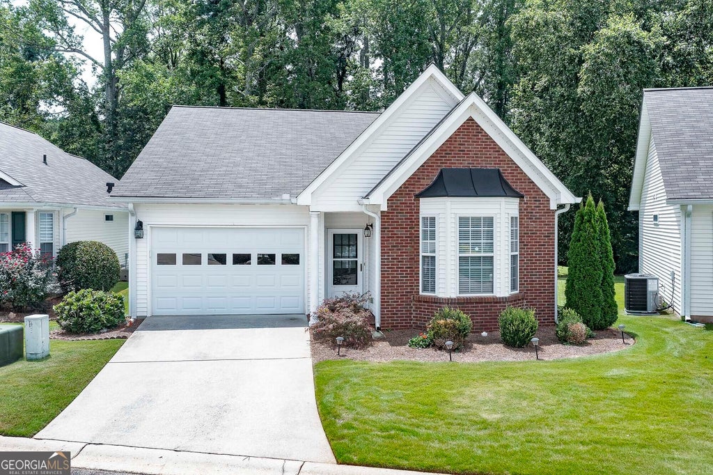 Photo of 310 Singing Brook Lane, McDonough, GA 30253 (MLS # 10841730)