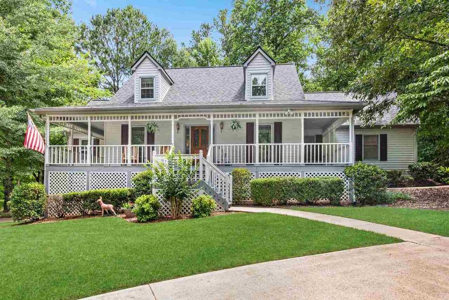 Beautiful cul-de-sac home surrounded by gorgeous, serene landscaping is the perfect country classic in Canton! This sweet, well-cared-for home has a master-on-main retreat complete with a deep tray ceiling and huge master bathroom that includes a dual vanity, separate shower and a Jacuzzi tub! The upstairs features two large guest rooms, a hall bath and a large bonus room, which is perfect for a craft room, study area or a sitting/reading room! The finished basement includes a media/game room and an office that leads to the third car garage and large workshop! Convenience is everything when you drive into the side entry 2-car garage and walk right into the kitchen!  You will feel welcomed in every way when you enjoy the rocking-chair wrap-around porch and the screened porch off the kitchen - perfect for morning coffee! The upper deck just outside the screened porch is the spot for dinners al fresco! Just steps down from there you walk onto a huge lower deck complete with a hot tub and plenty of room for deck chairs or an outdoor bar! The backyard is huge with lots of beautiful flowers and shrubs that you can enjoy all year long! If you've been looking for your "forever" home that is in perfect condition and located in the Hickory Flat/Dean Rusk/Sequoyah school district AND only minutes away from Canton, Hickory Flat, Woodstock, Roswell and Alpharetta, then you have found the one! Don't wait! This home is not going to be on the market long!