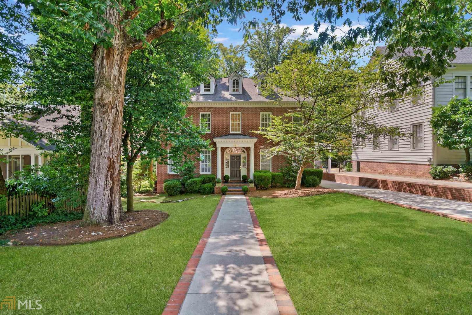 Gorgeous Druid Hills home perfectly located just seconds to Emory, Shops, Restaurants, Golf, Parks & everything the city has to offer! All brick construction featuring 4 finished levels of living space, an au-pair/in-law suite, striking designer accents & trim including marble fireplaces, built-ins and carefully designed floorplan that optimally utilizes the flow and space of the home. Grand entrance foyer is flanked by the formal living & dining rooms with impressive arched doorways that lead to the casual open concept, fireside family room w/ built-ins & modern kitchen w/ breakfast bar, granite, white cabinetry & ss appliances including a Sub-Zero refrigerator, butler's pantry & desk area. Main level also features a bonus room/bedroom & full & half bath.