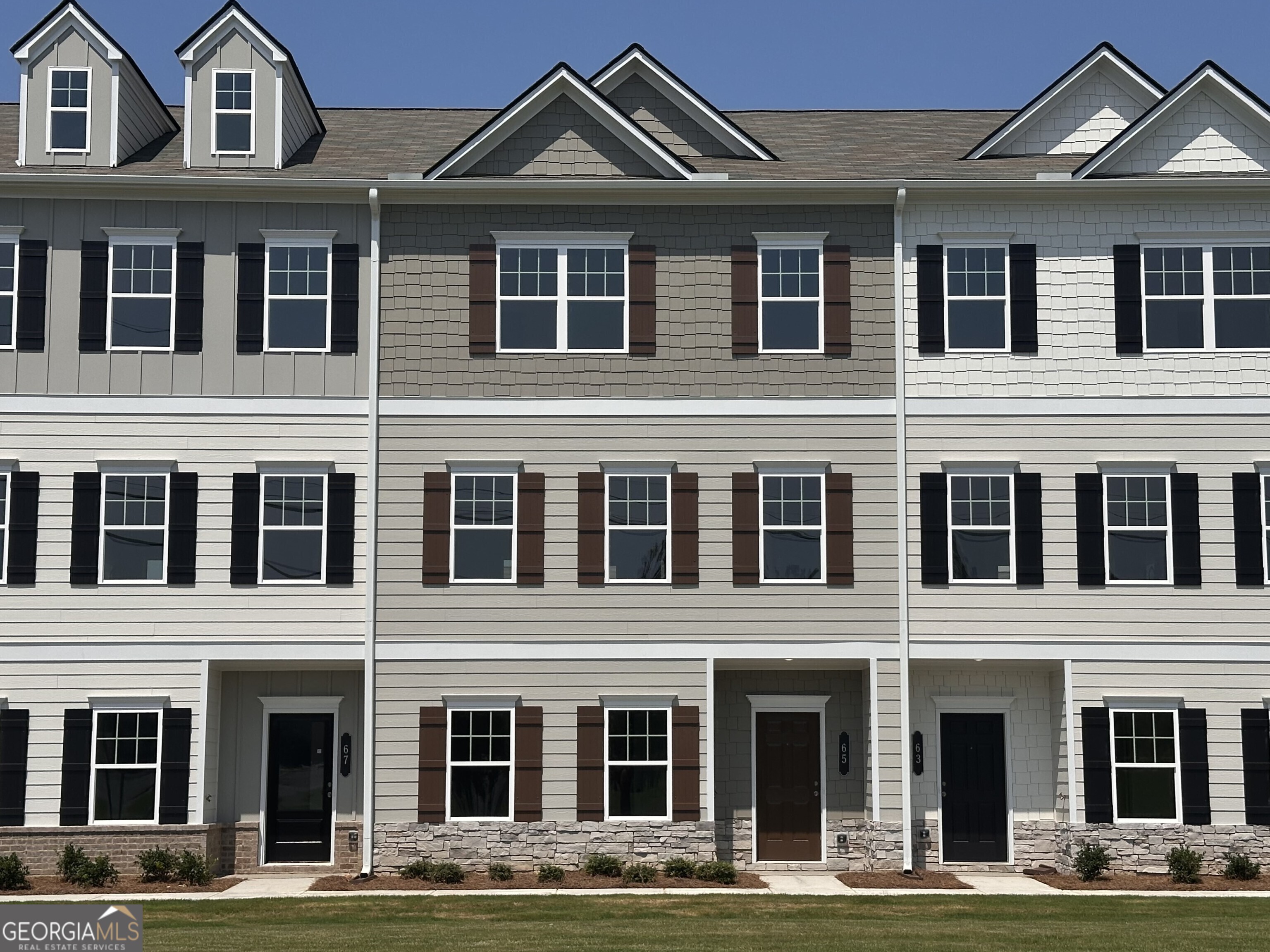 Move in Ready! The Richmond townhome, located in Smith Douglas Homes Sterling at The Villages. This plan is a two-car garage townhome with a modern design offering plenty of space. The first floor has a flex space ideal as an office, media room or playroom. The primary living space is on the second floor where the main living area boasts an open-concept seamless layout with a family room at the front of the home, dining area, an island kitchen with granite counters and upgraded cabinetry with crown molding that opens to the balcony. Vinyl Plank flooring throughout the main living area. Open iron rail staircase leads upstairs to the owner's suite which is situated at the rear of the home for added privacy and the owner's bath has a large tiled shower. Two bedrooms and a shared full bath complete this level. All floors have 9ft ceiling heights. Seller incentives with the use of one of our preferred lenders. Photos are representative of home.