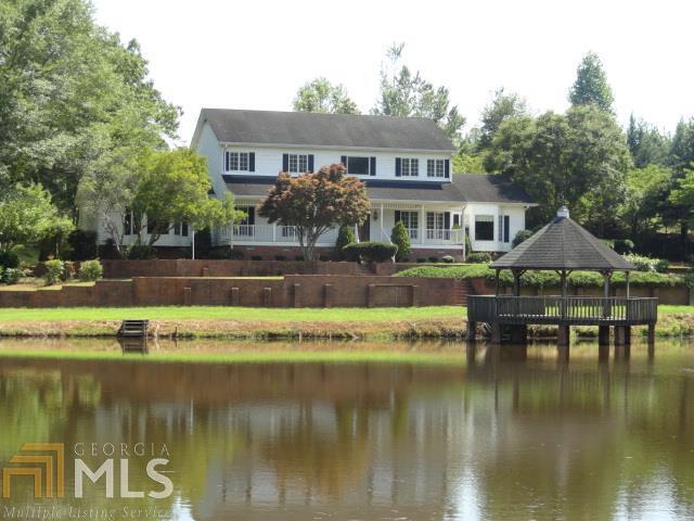 Great country home that needs to be restored to it's original beauty. Needs work but has heavy moldings and beautiful stairwell. 52.56 acres with stocked lake, barn and small guest house. No disclosure, sold "as is". Need POF or prequal letter with all offers.
