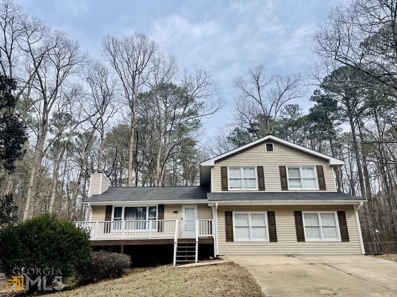 This large home located in the desired Turtle Cove Community is within minutes of the lake. The property is built for enjoying all nature has to offer with a large front porch, 3 rear decks and a fenced in back yard. As you enter the home, you are greeted with a foyer that leads you into the family room with vaulted ceilings. The hardwood floors carry throughout the home as you enter the kitchen with double wall ovens. The kitchen offers ample storage with countless cabinets. The home boasts two master en suites. The upstairs has 3 bedrooms and 2 baths. The primary master features a private deck overlooking the property. The downstairs provides another living space that can be utilized as a secondary living room, office, playroom or media room. It also has a guest room with an exterior entrance perfect for a teen suite or in-laws. The second master suite has deck off the rear of the home. Don't wait to make this house your home!