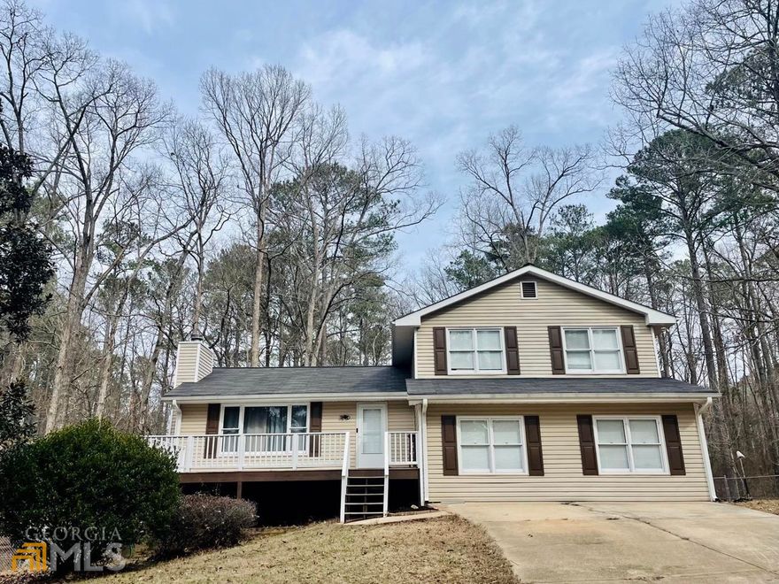 This large home located in the desired Turtle Cove Community is within minutes of the lake. The property is built for enjoying all nature has to offer with a large front porch, 3 rear decks and a fenced in back yard. As you enter the home, you are greeted with a foyer that leads you into the family room with vaulted ceilings. The hardwood floors carry throughout the home as you enter the kitchen with double wall ovens. The kitchen offers ample storage with countless cabinets. The home boasts two master en suites. The upstairs has 3 bedrooms and 2 baths. The primary master features a private deck overlooking the property. The downstairs provides another living space that can be utilized as a secondary living room, office, playroom or media room. It also has a guest room with an exterior entrance perfect for a teen suite or in-laws. The second master suite has deck off the rear of the home. Don't wait to make this house your home!