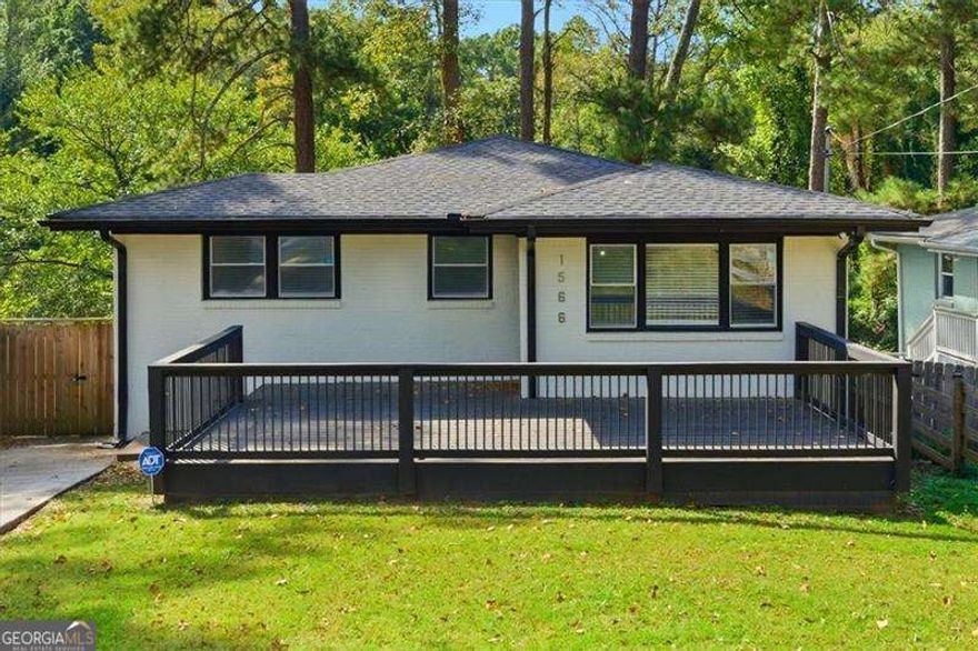 Experience the perfect mix of character, comfort, and opportunity in Atlanta's vibrant Westside! This 4-bedroom, 3-bath home in Hunter Hills has been completely renovated from top to bottom, offering a stylish and functional layout that stands out from the rest. Inside, you'll find eye-catching designer touches like statement lighting, bold wallpaper, and custom wood accents that bring warmth and personality to every room.    The kitchen and bathrooms shine with sleek Italian quartz counters, blending elegance with everyday practicality. Original hardwood floors and high ceilings keep the home feeling spacious and full of charm.    Enjoy your morning coffee on the large front porch or unwind on the expansive back deck that spans the entire width of the home. The outdoor spaces add to the already perfect layout for entertaining!  The daylight basement, with both interior and exterior entry, provides extra storage or flexible living space to fit your needs.    Located just minutes from the BeltLine, Mercedes-Benz Stadium, Georgia Tech, and downtown Atlanta, plus quick access to I-20 and MARTA,  a home this size is a rare find in one of the city's fastest-growing neighborhoods.