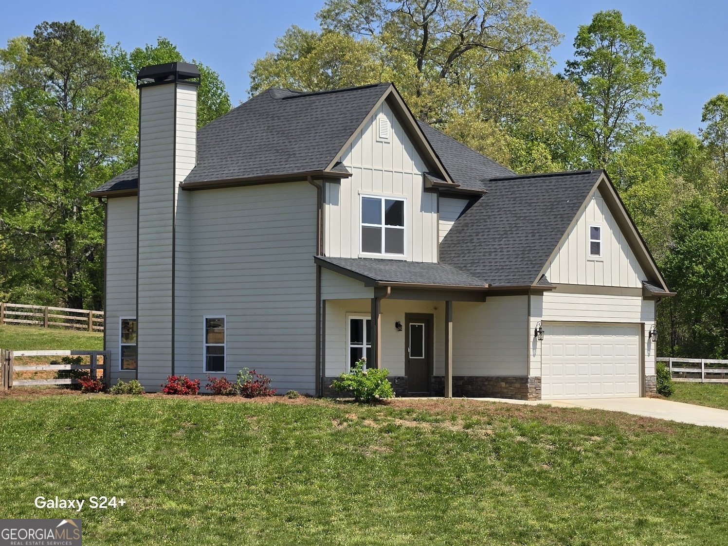 Completed in 2022 this splendid, 3- bedroom 2.5 bath home on 1.5 acres is located in the desirable subdivision of Stonington of Mount Airy. A minute drive to HWY 441 and 5 minutes to shopping and dining in Clarkesville, GA. A concrete drive brings you up to an oversized garage. The exterior of the home is elegant and stylish with a combo of board and batten and traditional siding with rock facade. The color choices throughout are earth toned and pleasant. A walkway leads you to the covered front porch. Upon entrance you find an arched entry way to a home office or playroom. The main level features 9-foot ceilings, luxury vinyl plank flooring, open concept living/dining and kitchen area. The kitchen is spacious with shaker style cabinets, granite countertops, large island and subway tiled backsplash. In the kitchen area is a half bath for guests and the entry to the garage. Upstairs is a utility room, 3 bedrooms, two that share a bath. The third bedroom is owner's suite complete with a walk-in closet, double vanities and gorgeous, tiled shower with frameless shower door. Off of the kitchen is a covered patio perfect for enjoying north Georgia weather. The current owners had a 3 board wood fence with gates installed for the 4 legged family members. VA Assumable Loan.