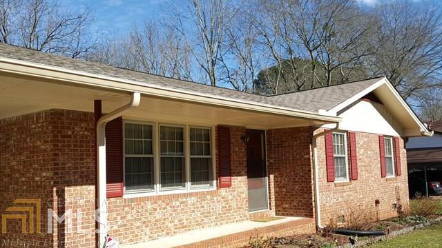 This is an amazing property. Very well maintained and loved. Warm and inviting as soon as you enter. Nice comfortable kitchen all appliances remain. Large dining room. Huge brick fireplace then step into a beautiful 15 X 30 Bonus room on the back of the house. Light and open. Walks out to large patio area with privacy wall over looking big fenced back yard. Property also has a one car garage/shop with power. 3 sides brick newer roof. This is a must see for sure. Easy access and very convenient to I-20 and schools. Back on market due buyer default. HVAC only 5 years old. Roof only 7 years old. Reduced to sell