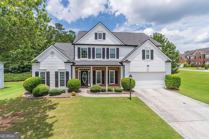 Meticulously kept 2 story home with amazing curb appeal. This place feels like home from the moment you step onto your cozy front porch. 20 Foot high foyer leads to spacious family room open to kitchen and breakfast area. Separate dining room with coffered ceilings and wainscotting is perfect for those large family gatherings were lifetime memories are made. You will love having the master bedroom on the main level. Oversized bedroom suite, double vanity in bathroom, separate tub and shower and walk in closet provide all the comfort you can ask for. Four roomy secondary bedrooms on the second floor are perfect to accomodate your large family or give you the flexibility to use the additional rooms as entaintanment space or office. Come see what your next home looks like today and lets make a deal.