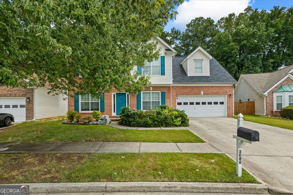 Welcome Home to 3086 Boulder Creek Rd - Timeless Charm in the Heart of Snellville This well-kept 4-bedroom, 2.5-bath home offers 2,291 square feet of functional space designed for everyday comfort and effortless flow. Nestled in a quiet, established neighborhood, this home offers the perfect blend of comfort, functionality, and timeless appeal. Inside, you'll find a warm and welcoming layout featuring a formal living room, a separate dining area for hosting guests, and a cozy family room with a brick fireplace-perfect for those relaxed evenings at home. Step into a bright foyer flanked by formal living and dining areas-ideal for gatherings or flexible use. The central family room features a beautiful fireplace and connects seamlessly to an eat-in kitchen with ample cabinetry, counter space, and natural light. Upstairs, discover four generously sized bedrooms including an oversized primary suite with tray ceilings, a large walk-in closet, and a private bath with dual vanities, a soaking tub, and separate shower. The secondary bedrooms provide space for guests, hobbies, or remote work. Out back, enjoy a spacious yard with endless possibilities-garden, play, entertain, or simply relax. Conveniently located near schools and shopping, this home is move-in ready with room to personalize. Don't miss your chance to make this Snellville classic your own!