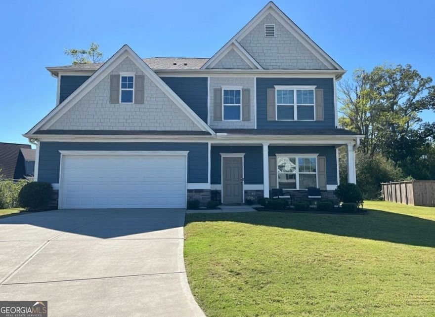 Get a 1/0 rate buy-down for the first year using the Seller's preferred lender! Experience modern sophistication in this move-in ready home nestled on a quiet cul-de-sac within one of Cartersville's most sought-after neighborhoods. Thoughtfully designed for today's lifestyle, this two-story residence combines timeless style with a highly functional layout, featuring two primary suites ideal for multigenerational living.  The two-story foyer welcomes you with wide-plank flooring and abundant natural light that flows seamlessly into the open-concept living area. A gas fireplace anchors the spacious family room, offering an inviting atmosphere for both everyday living and elegant entertaining.  The chef's kitchen is beautifully appointed with granite countertops, new stainless-steel appliances, a walk-in pantry, and a breakfast bar perfect for casual dining or morning coffee.  Upstairs, the primary suite serves as a private sanctuary complete with a tray ceiling, expansive walk-in closet, and a bath featuring a double vanity, soaking tub, and walk-in shower. A second suite with its own private bath and large walk-in closet provides ideal comfort for extended family or guests. Three additional bedrooms offer versatility for a home office, media room, or growing household.  The second-floor laundry room is thoughtfully designed with a utility sink, storage shelving, and folding station for everyday convenience.  Outdoors, unwind on the charming front porch or entertain on the rear patio overlooking a private, tree-lined backyard. The property's cul-de-sac location ensures privacy and minimal traffic, while the transferable termite bond offers additional peace of mind.  Residents enjoy exclusive community amenities including a swimming pool, basketball court, clubhouse, and fitness center-all within minutes of downtown Cartersville, shopping, dining, and easy access to I-75.