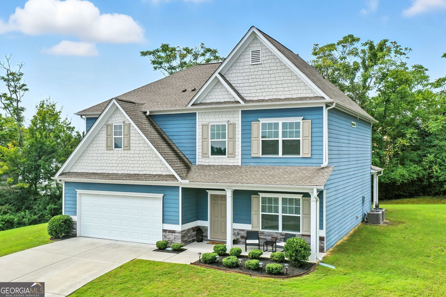 This move-in ready home combines smart layout with modern finishes, all tucked into a cul-de-sac setting. With five full bedrooms and four full bathrooms, including a main-level bedroom and full bath, there's room to host, work, and relax. The two-story foyer sets a bright and welcoming tone the moment you walk in. Wide-plank wood-style floors run throughout the main level, leading into an open living space anchored by a gas fireplace and views out to the backyard. The kitchen offers plenty of workspace with granite countertops, new stainless-steel appliances, a walk-in pantry, eat in kitchen and a breakfast bar perfect for casual meals or conversation. Upstairs, the oversized primary suite is a true retreat with a tray ceiling, large walk-in closet, and a private bath with double vanity, soaking tub, and a walk-in shower. In addition to the master suite, there is a 2nd teen suite/in-law suite with a full bath & large walk-in closet. The laundry room is conveniently located on the 2nd floor and is generously sized. It includes a utility sink and storage shelving with still plenty of room to add a table for folding clothes. Outside, enjoy the peace & quiet while sipping on coffee either on the inviting front porch or unwind on the covered back patio that looks out to a private tree-lined backyard. The spacious lot adds to the privacy while the cul-de-sac location means no through traffic. Termite bond is in place and is transferable. Enjoy the community's amenities including swim, tennis, clubhouse, fitness center, and is ideally located close to shopping, restaurants, downtown Cartersville and quick access to I-75.
