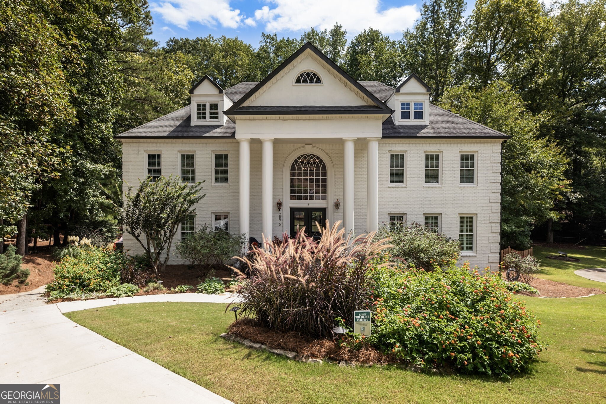 Magazine-ready luxury meets nature in this one-of-a-kind Northcliff on the River estate. Completely reimagined by a designer-builder team, this six-bedroom, seven-bath home offers soaring spaces, reclaimed wood and stone accents, designer lighting and personal touches, two primary suites, large ensuite bedrooms with walk-in closets, a breathtaking scullery and oversized laundry, a chef's kitchen with Wolf professional range and built-in espresso maker, a sauna, and all-wood floors. A light-filled walk-out terrace level extends your living area seamlessly outdoors, creating the ultimate space for movie nights, teen hangouts, or multigenerational living. Too many amenities to mention - every inch of this home is crafted for style, comfort, and togetherness. The lifestyle is unmatched. Children can bike or walk safely on a private trail to friends' homes, swim-team practice, or the river - no busy roads, just community. Enjoy summer pool parties, neighborhood events located only six minutes to GA-400, 12 minutes to Avalon, 8 minutes to Historic Canton Street, and 25 minutes to Atlanta's airport, this home gives you extraordinary convenience while still feeling like a private sanctuary. Outdoors, the flat 1.4-acre lot is a true entertainer's and nature-lover's dream. Includes established gardens; a stone firepit; and a creek alive with deer, blue heron, and hawks. Future Pool Ready. Steps from the Chattahoochee River and miles of walking and biking trails, this property blends Atlanta's best natural amenities with turnkey luxury - a once-in-a-lifetime opportunity for the next family to create their legacy here.