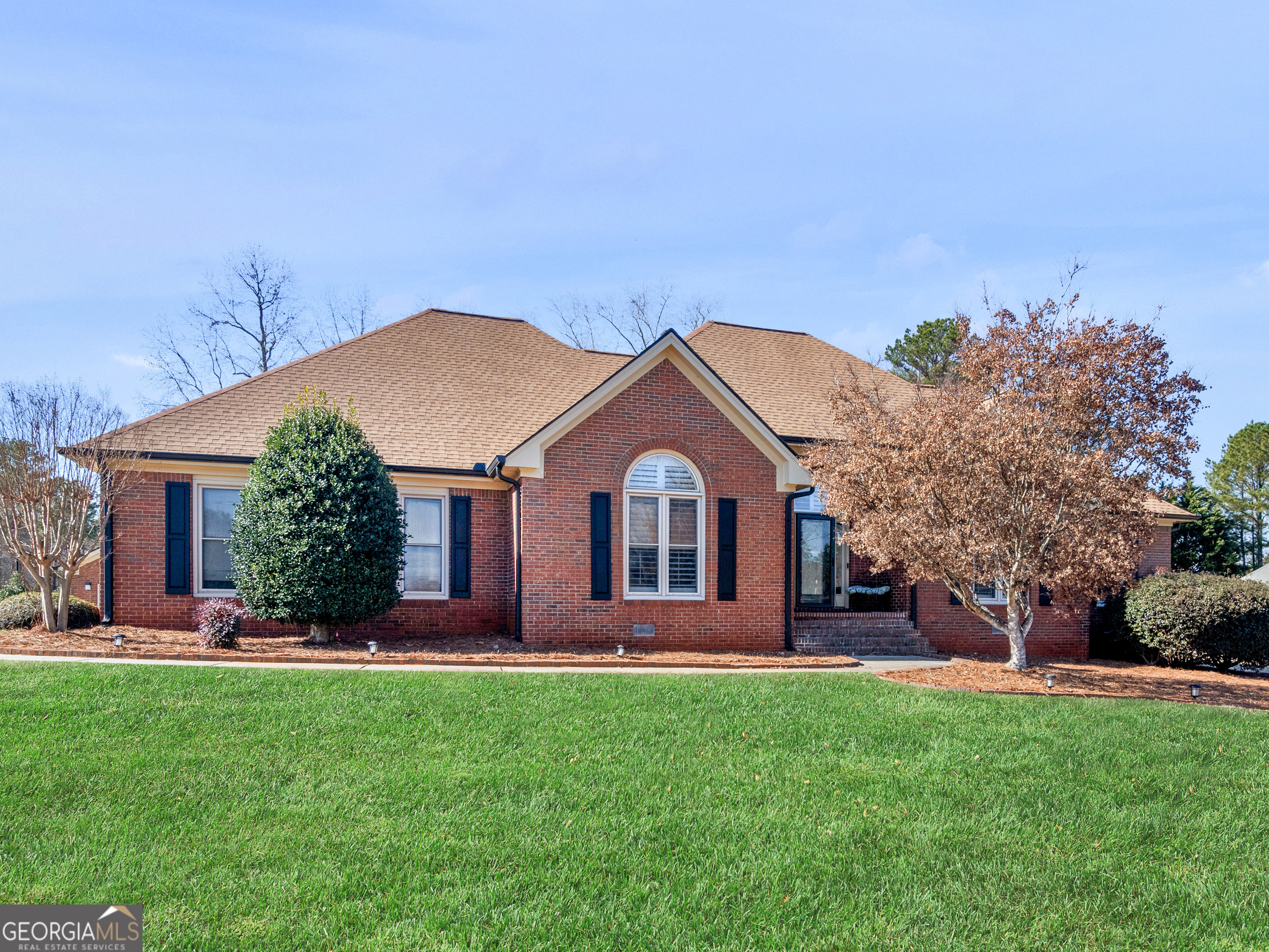 Welcome home to this stunning 4-bedroom, 2.5-bathroom brick ranch, perfectly situated on a spacious corner lot in the highly sought-after Union Grove school district. This beautifully maintained home offers an inviting layout with gleaming hardwood floors, a formal dining room, and a well-appointed kitchen featuring granite countertops, a breakfast bar, pantry, double wall ovens, and a cozy breakfast area with bay windows. The family room boasts a tray ceiling and a corner fireplace, creating a warm and inviting space for gatherings. Retreat to the primary suite on the main level, complete with a tray ceiling, double vanity, luxurious soaking tub, separate shower, and two walk-in closets. An incredible bonus to this property is the detached guest house, featuring its own full bathroom, kitchenette, HVAC system, deck, and private septic system-ideal for guests, in-laws, or rental potential. Step outside to your entertainer's paradise, where a large deck extends from the main house, leading to a custom patio with a fireplace, multiple seating areas, and a fully fenced backyard for privacy and relaxation. This exceptional home offers the perfect blend of comfort, style, and outdoor enjoyment. Schedule your showing today! Ask how you can receive up to $1500 credit by using one of our preferred lenders. Exclusions may apply.