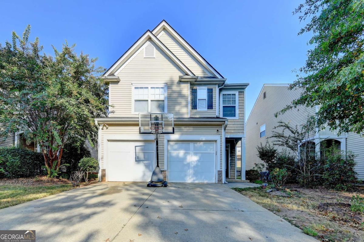 This home is filled with character and comfort, offering stylish tile flooring, large windows that bring in abundant natural light, and a cozy brick-accented fireplace. The kitchen comes equipped with updated appliances, ample counter space, and plenty of cabinets for storage. Step outside to enjoy the spacious back patio-perfect for entertaining guests or simply relaxing in peace.