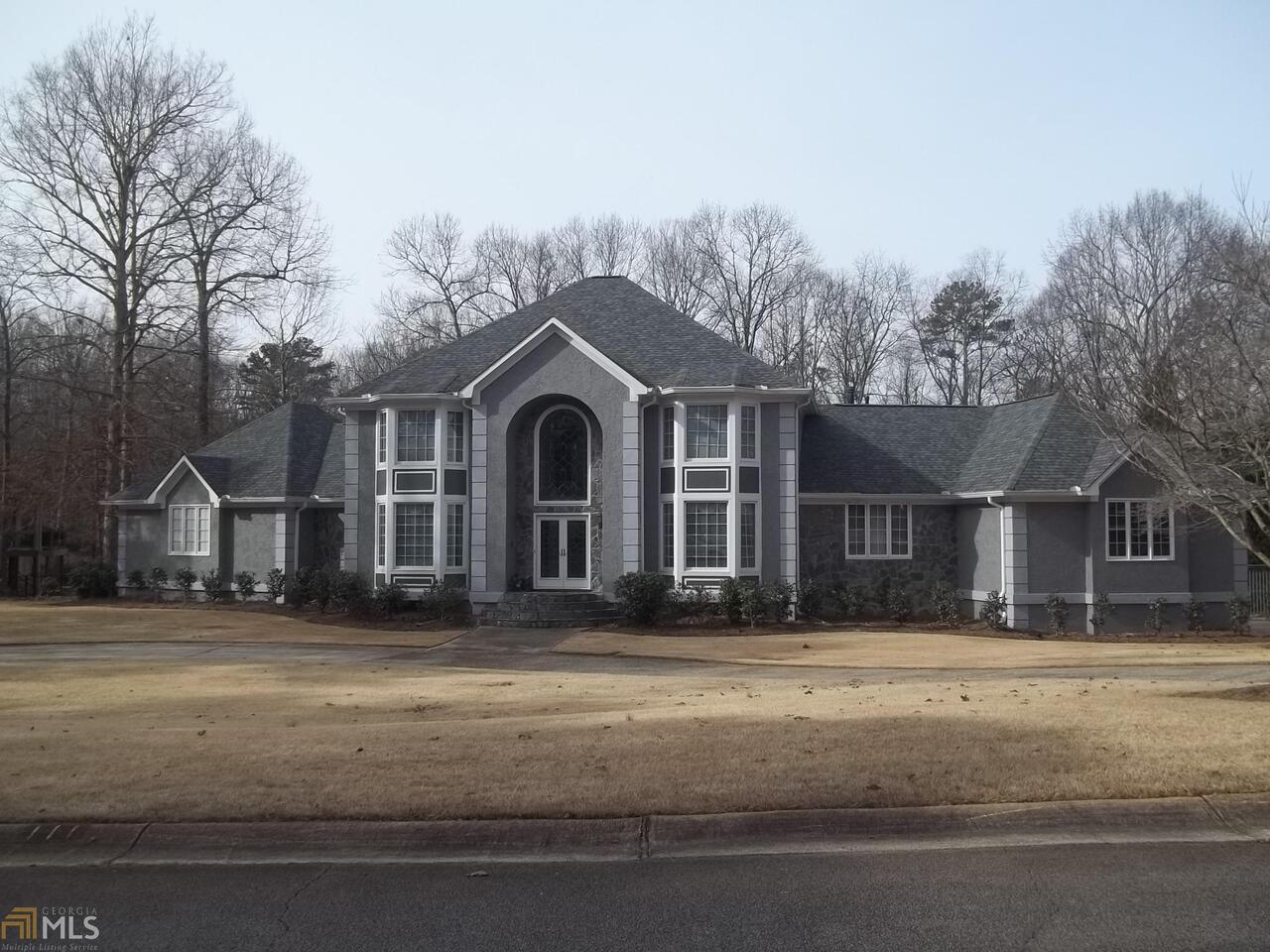 OUTSTANDING EXECUTIVE STUCCO 5 BEDROOM, 4.5 BATH HOME IN THE HEART OF PEACHTREE CITY. THE TERRAZO TILE 2 STORY ENTRY IS ACCENTED WITH A MAGNIFICANT CHANDELIER THAT HIGH LIGHTS THE DOUBLE LEADED DOORS AND PALADIUM WINDOW. THE OWNER SUITE ON MAIN INCLUDES AN EXTRA LARGE SITTING AREA W/ PRIVATE DECK, OVERSIZED WHIRLPOOL BATH, GLASS SHOWER, AND 2 WALK IN CLOSETS. THE SPECTACULAR KITCHEN BOASTS 30+ CABINETS, ISLAND COOKTOP, TILE COUNTERS AND FLOOR, BREAKFAST ROOM OPENS TO SUNROOM, FAMILY ROOM WITH 30' CEILING AND STONE FIREPLACE. IN-LAW SUITE ON LOWER LEVEL INCLUDES FULL BATH, HUGE BEDROOM, FAMILY ROOM WITH STONE FIREPLACE AND PARTIAL KITCHEN. FEATURES INCLUDE AN OFFICE, HANDI CAP LIFT IN GARAGE, IN GROUND POOL, FENCED YARD,3 HVAC UNITS & WHOLE HOUSE GENERATOR