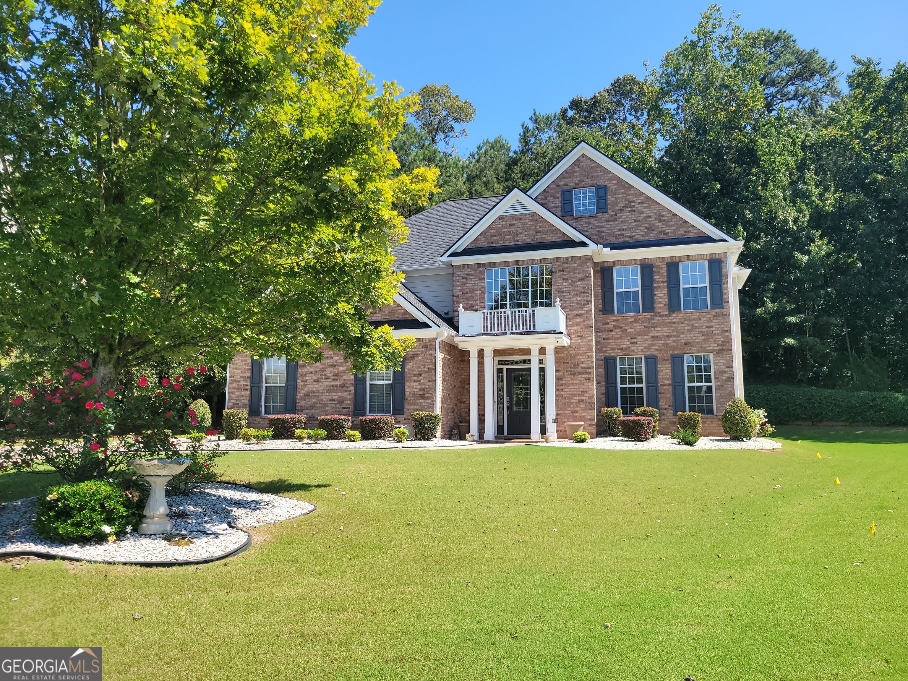 Welcome to your dream home! Nestled on a private half-acre lot (approx.), this beautifully crafted brick-front residence with Hardie plank siding offers the perfect balance of luxury and comfort. Inside, you'll find a thoughtfully designed floor plan featuring a guest bedroom on the main level-ideal for visitors or multi-generational living. The spacious owner's suite offers a true retreat with a cozy sitting nook, dual vanity, jacuzzi tub, separate shower, and walk-in closet. The heart of the home is the gourmet kitchen complete with a large island, gas-burning stove, double oven, bar seating, and a bright sitting area that overlooks the private backyard. Perfect for entertaining or family gatherings! Step outside to your own private oasis. The outdoor fireplace and built-in grill make this backyard a true extension of your living space, providing a relaxing and inviting atmosphere year-round. Highlights include: * 2-story brick-front home with Hardie plank siding * Private half-acre lot with lush backyard * Guest bedroom on main level * Spacious owner's suite with sitting nook, jacuzzi tub, dual vanity, and separate shower * Gourmet kitchen with island, bar seating, double oven, and gas stove * Outdoor fireplace and grilling station for entertaining Located in sought-after Fulton County, this home combines privacy, elegance, and modern amenities-all while being close to top-rated schools, shopping, dining, and major highways.