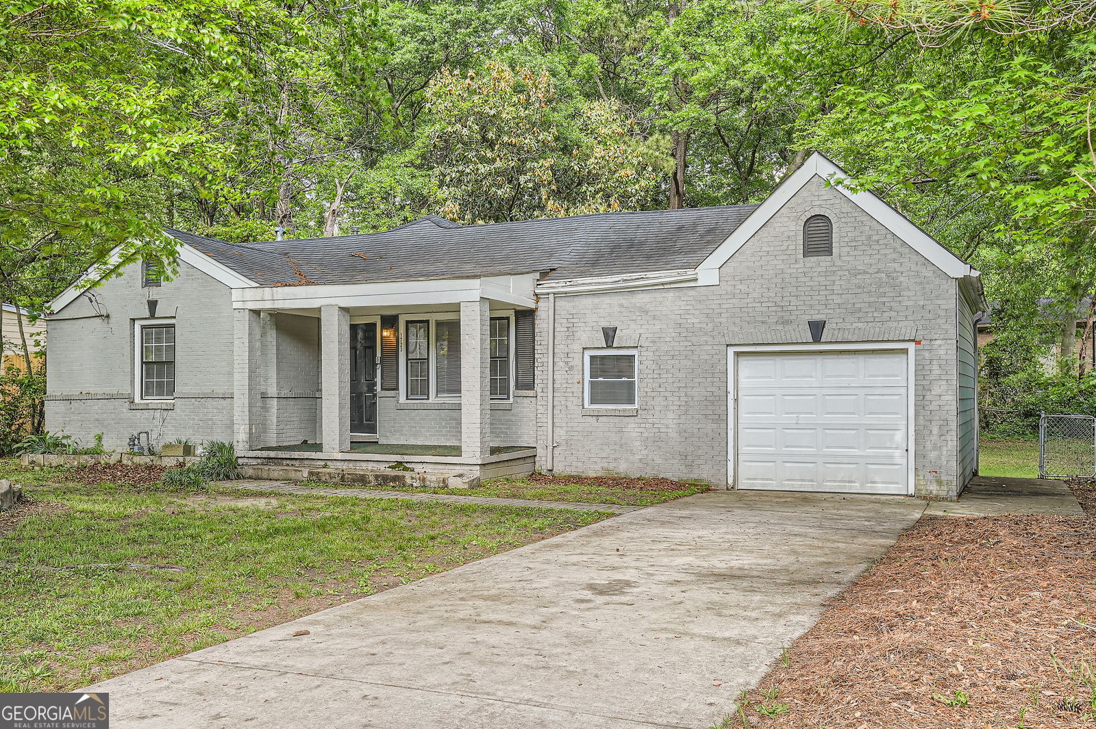 Great opportunity for one level 4 bedroom / 3 bathroom ranch home in Marietta. Enjoy one level living in this ranch home. This home features laminate and tile floors throughout and no carpet. The kitchen features an gas range, dishwasher, and fridge, all appliances included. A living room, separate dining room, mud room, four bedrooms, three bathrooms, and one car garage round out the one level. Relax on the quaint front porch or entertain in the level back yard. Close proximity to downtown Marietta, Truist Park, i75 and i285, and all the shopping, dining, and entertainment Cobb County and Atlanta have to offer.