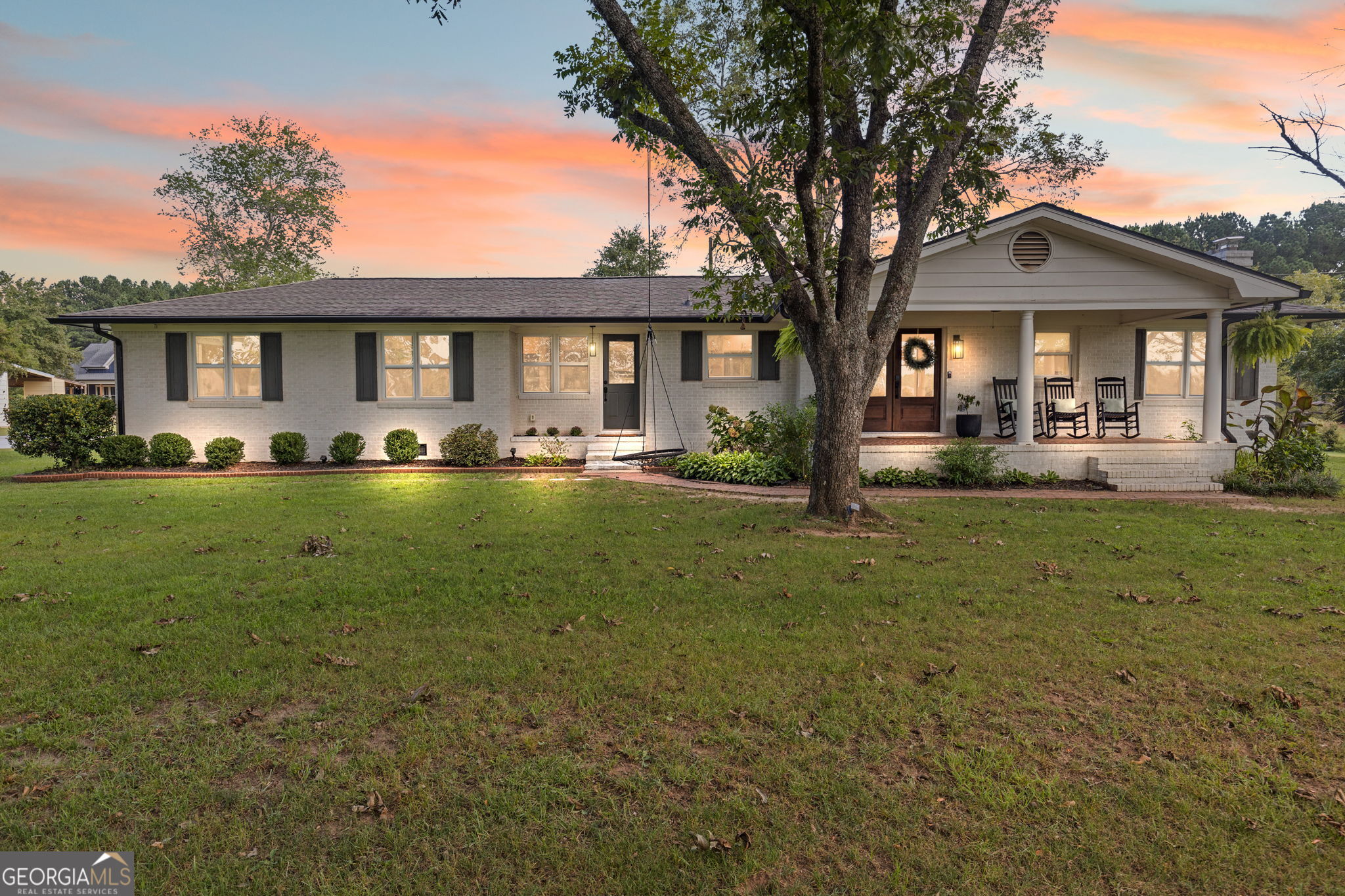 Sitting on almost 3 ACRES, this fully renovated 1945 ranch is the kind of place that just feels like home. The kitchen steals the show as soon as you walk in with timeless hardwood floors, a custom hood vent, cozy banquette seating, and a fireplace of its own. The spacious living room continues the charm with a rounded fireplace and beamed ceilings that add character and warmth. The split-bedroom layout gives everyone their own space, with a roomy primary suite that even has a private office-perfect for working from home or easily converted into dream dual closets. Three additional bedrooms are all generously sized, including one that was recently designed as a second primary suite with a beautifully designed bathroom. The original hardwoods bring warmth to the bedrooms, and the secondary bath's vintage green tub is a fun nod to the home's history. Outside, there's plenty of room to relax or entertain. Acres of room, actually. The brand-new 20x40 deck is ready for fall football parties, cookouts, or quiet mornings with coffee in hand. The 16x32 wired shop is the ultimate bonus space-ideal as a workshop, toy storage, or even a home gym. All major mechanicals are from 2020 (Roof, HVAC, water heater and septic system)! With its thoughtful updates, character-filled details, and wide-open land, this home has the best of both worlds-modern comfort wrapped in timeless charm. This is more than a house-it's the perfect place to call home. Appraisal available.